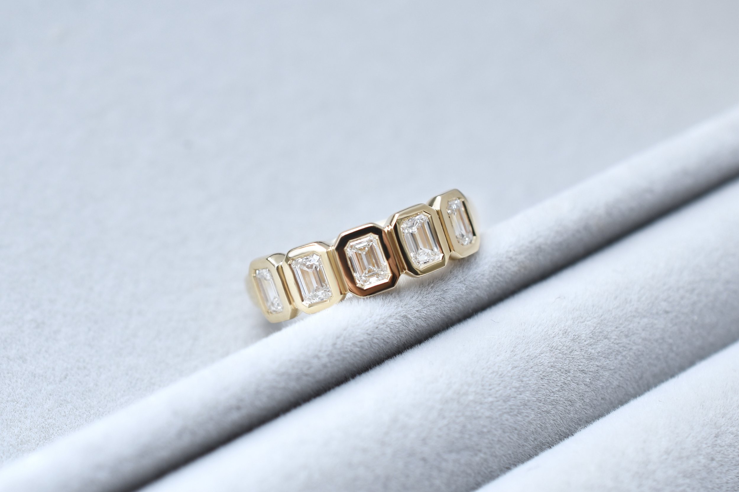 August Bespoke Emerald Cut Diamond Bezel Ring in Yellow Gold.jpg