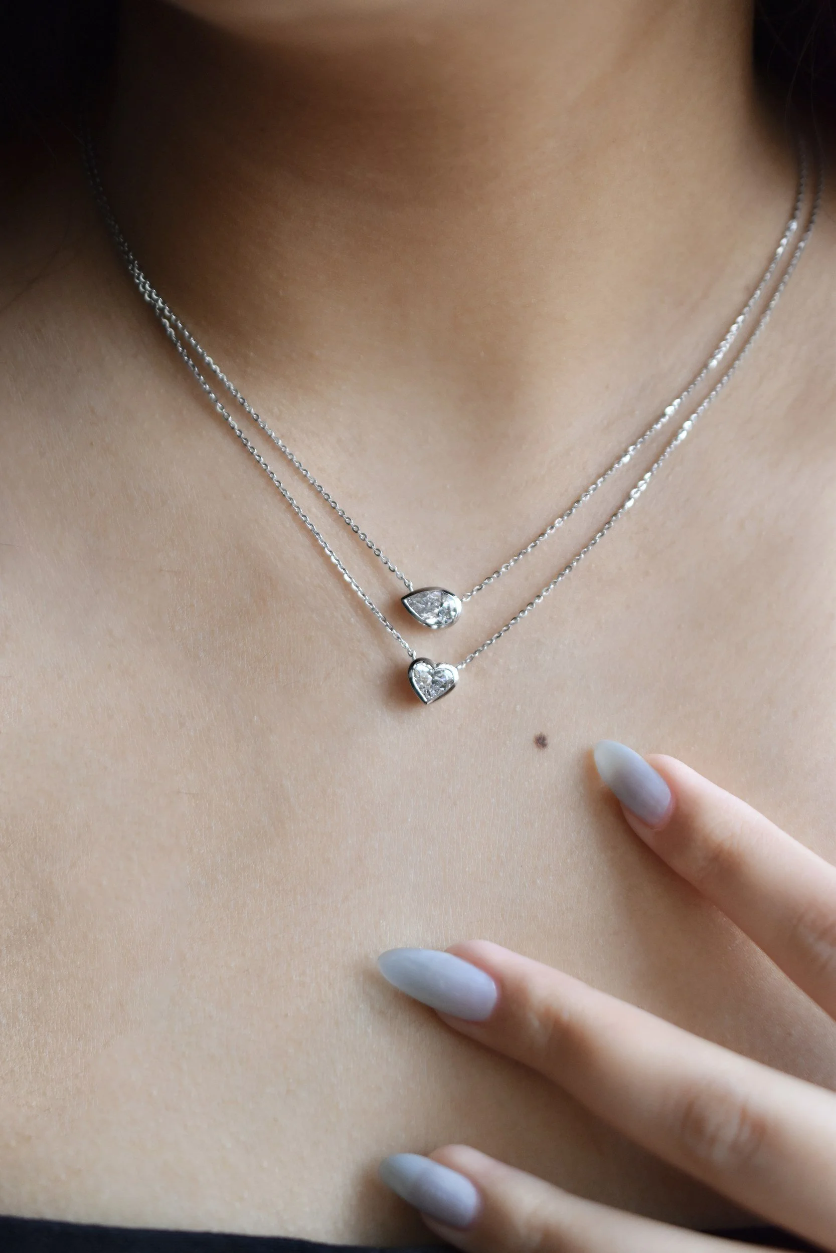 Louna bezel diamond necklace in white gold, pear and heart shapes layered, by August Bespoke Singapore