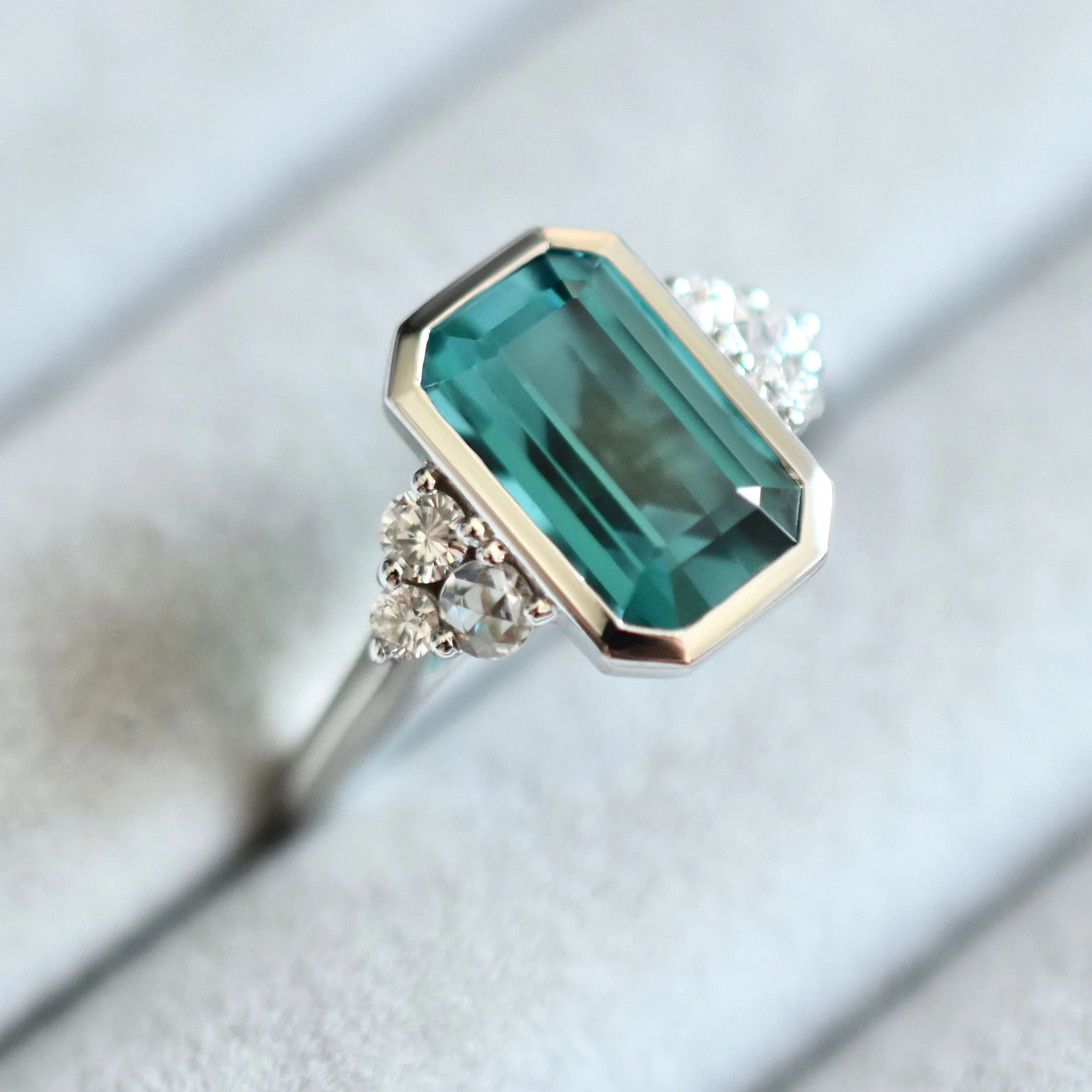 Rox Emerald Cut Lagoon Tourmaline Ring with Diamond Cluster in White Gold 2.jpg