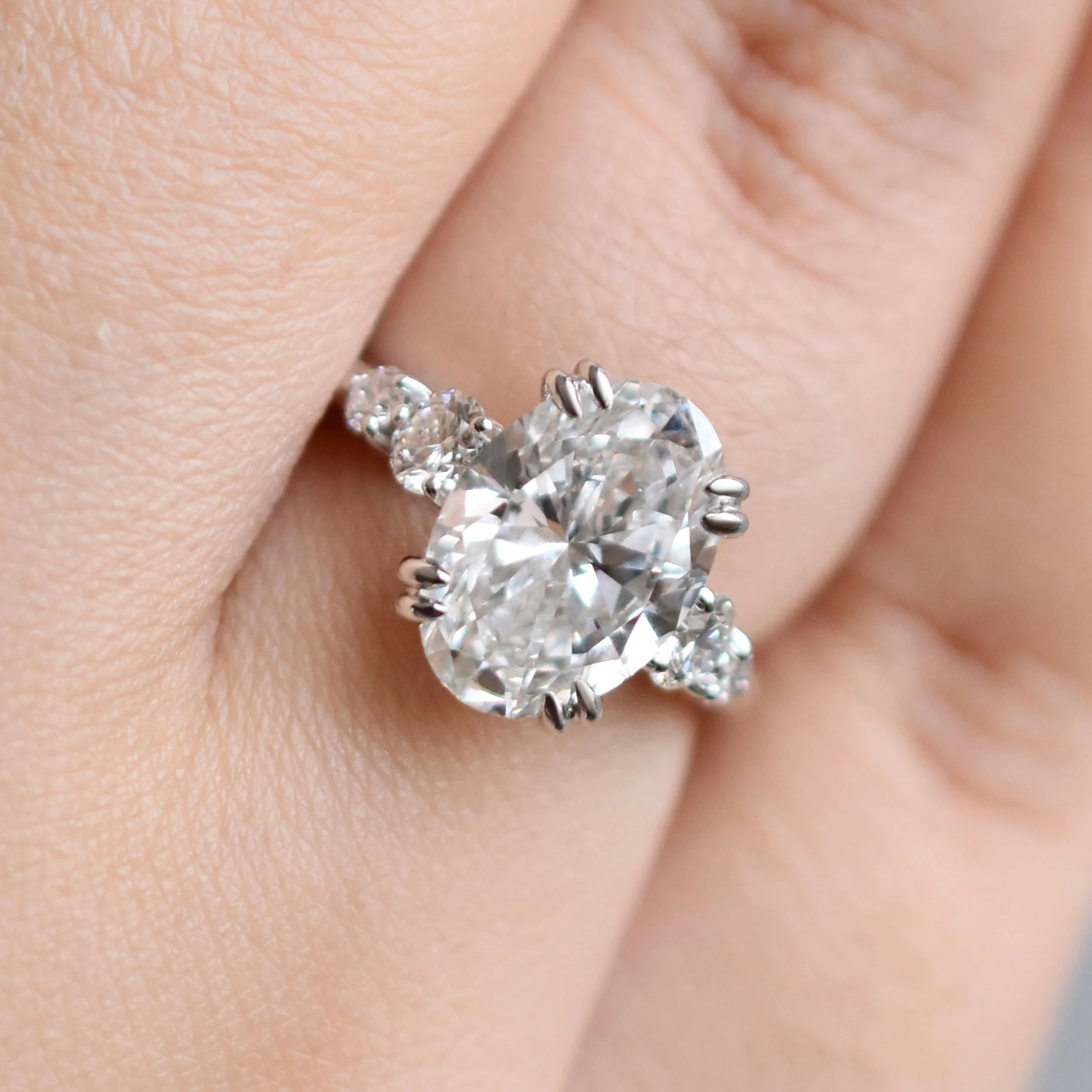 Valora Oval Diamond Ring with Graduated Round Side Diamonds in White Gold1.jpg