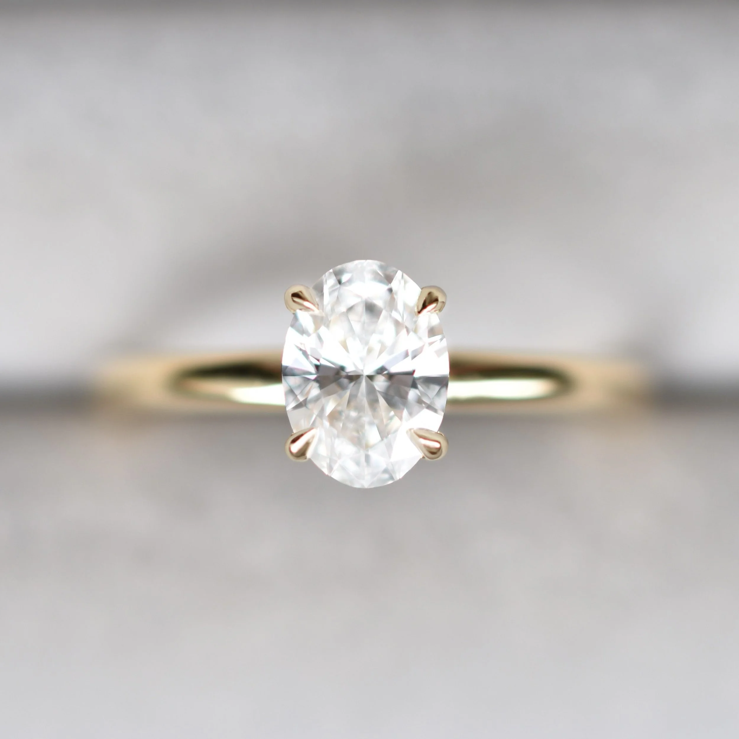Portia Minimalist Four Prong Oval Diamond Solitaire Ring in Yellow Gold 4.jpg