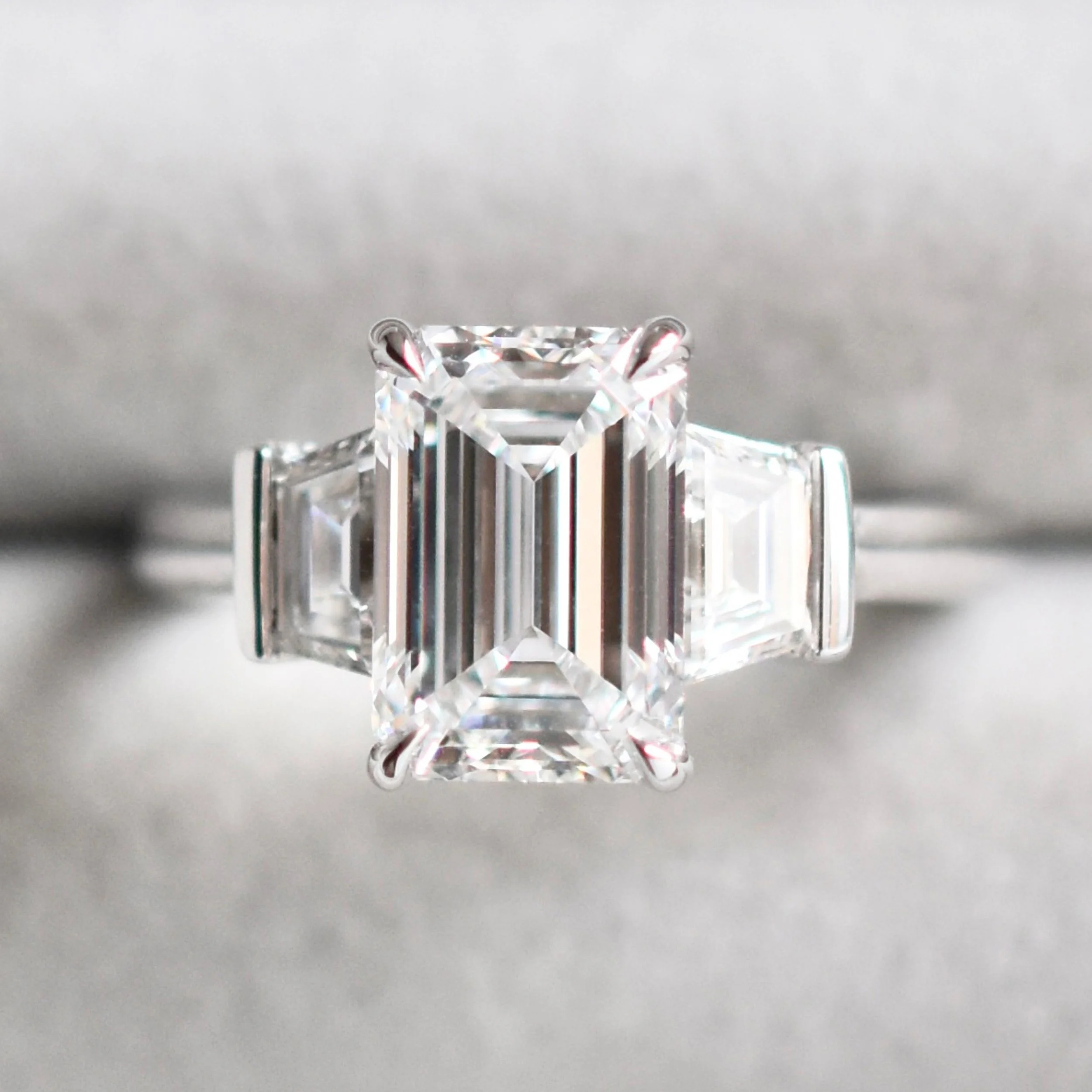Beverly Emerald Cut Three-stone Diamond Ring with Trapezoids 3.jpg