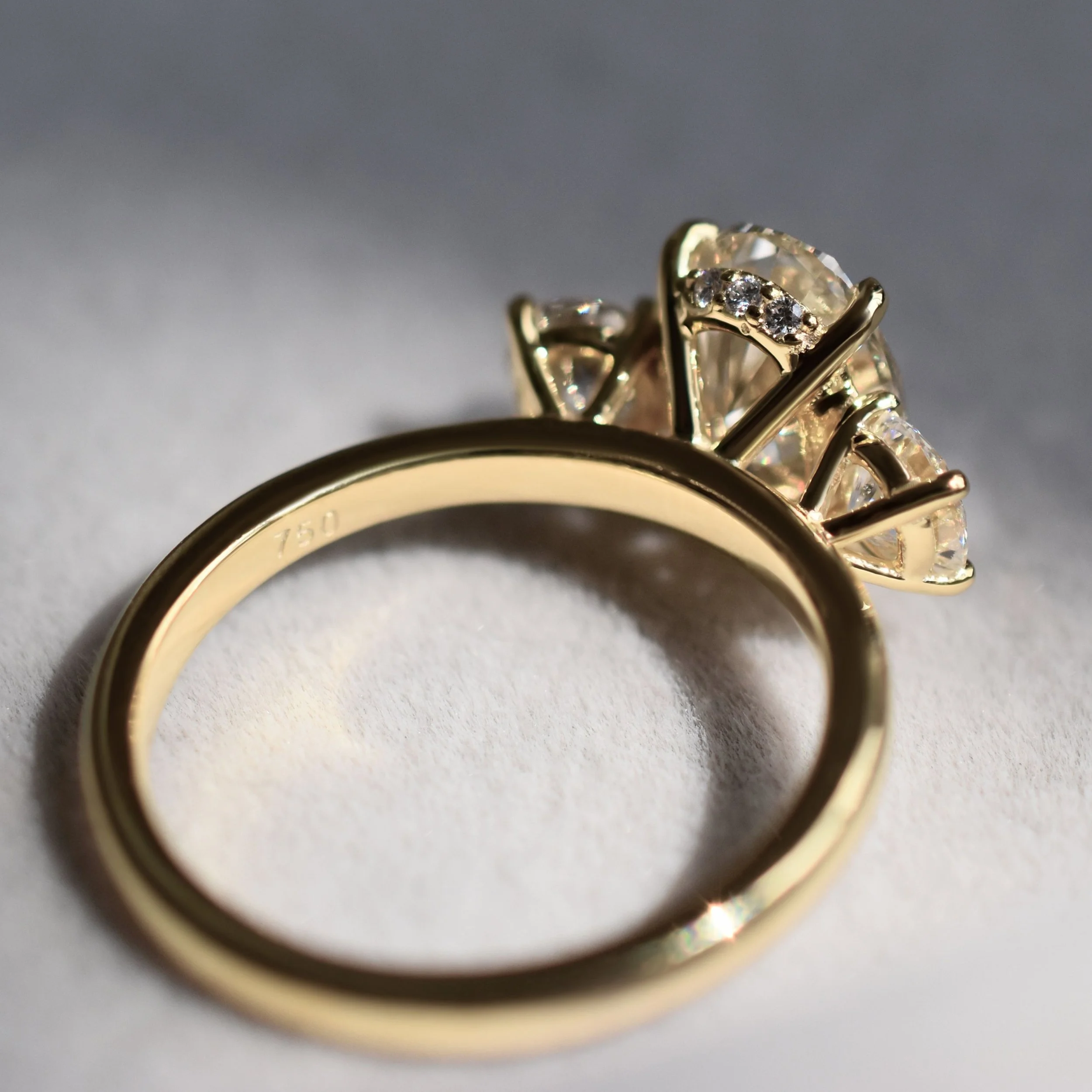 Christie Oval champagne diamond three-stone ring in champagne gold4.jpg