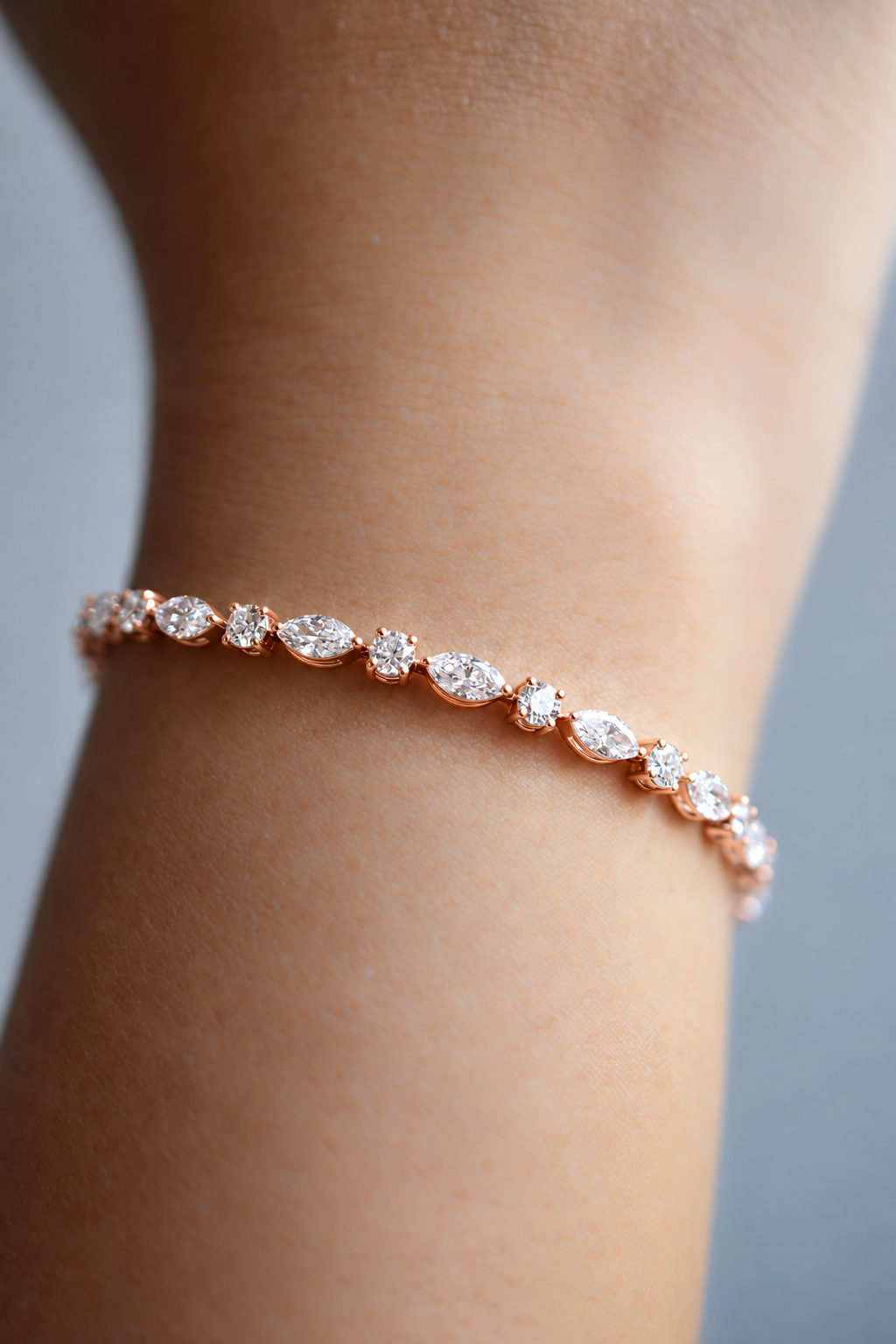 Élodie diamond bracelet in rose gold with round and marquise diamonds, worn on the wrist, by August Bespoke Singapore