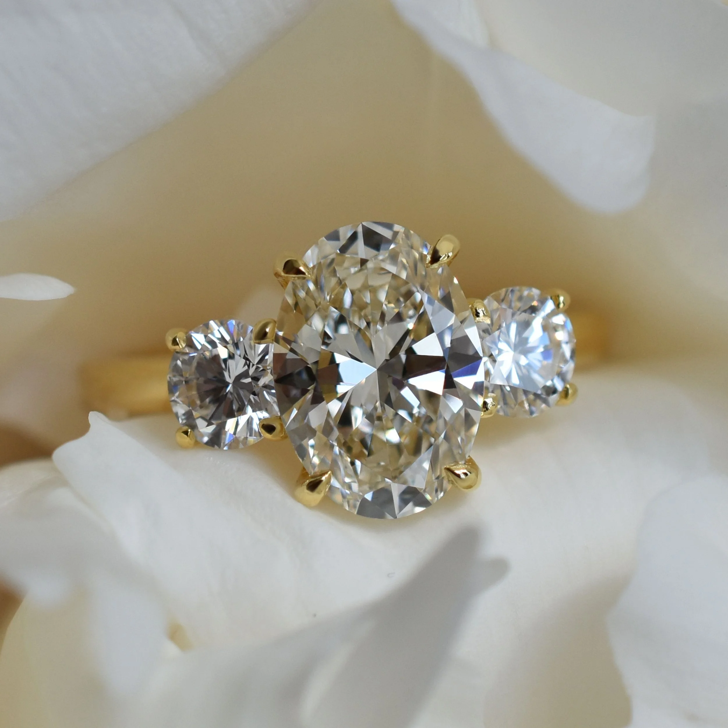 Christie Oval champagne diamond three-stone ring in champagne gold3.jpg