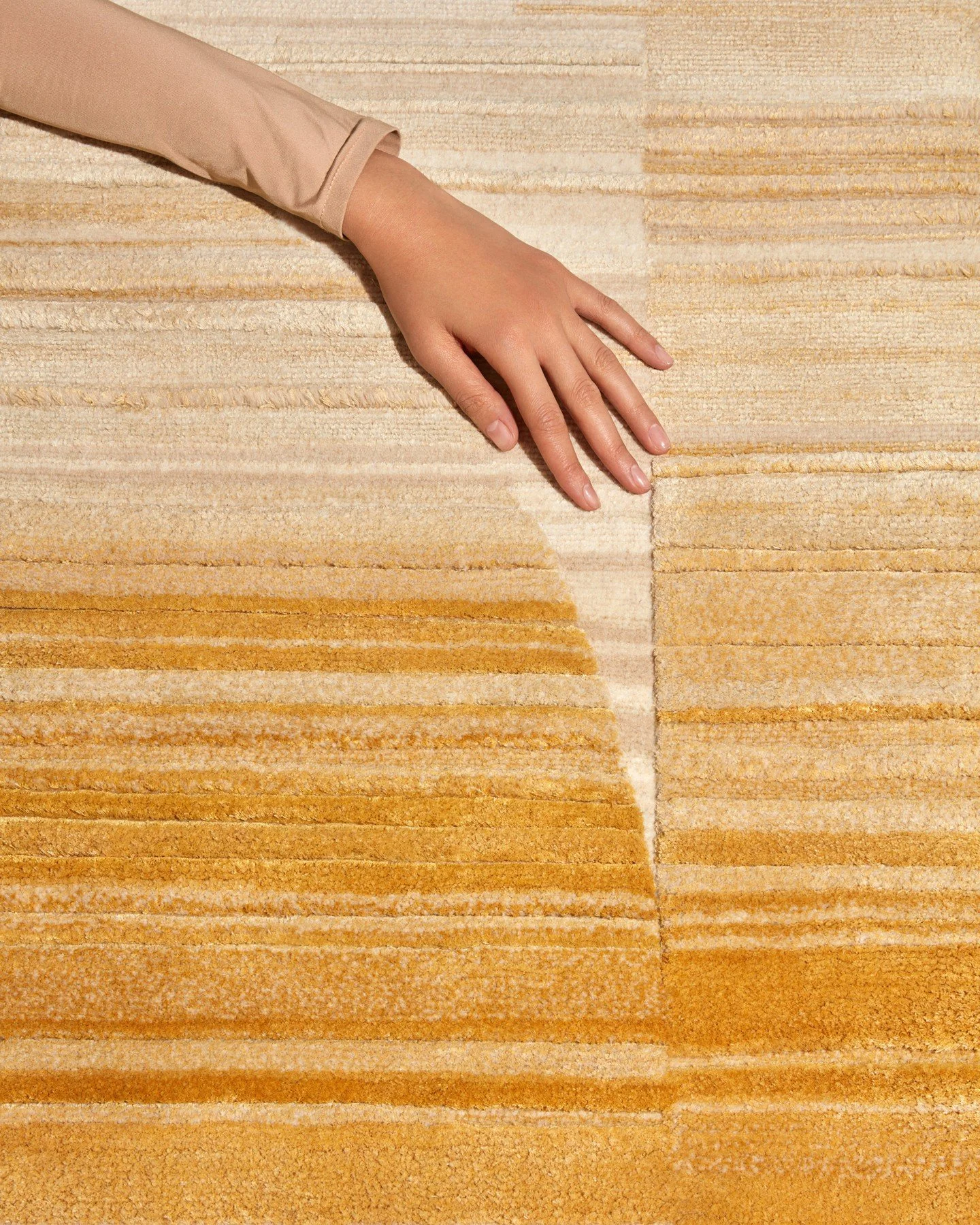 Obscura Goldenrod from our Loominary Collection plays with light and movement, curving across the floor in gestures that feel both deliberate and effortless. ⁠
⁠
Its low 4mm field and 7mm highlights catch warmth in a soft, honeyed glow, while Tibetan