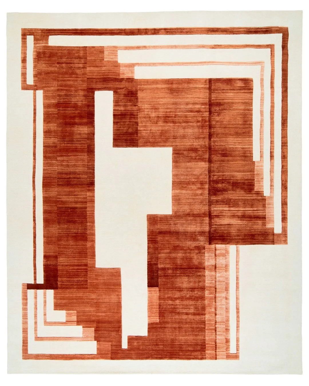 Piazza Terracotta balances structure and subtlety. ⁠
⁠
Asymmetrical borders meet geometric forms, while silk threads catch the light and pile gradations add depth. Handknotted in Nepal from Tibetan wool and Chinese silk, Piazza turns every floor into