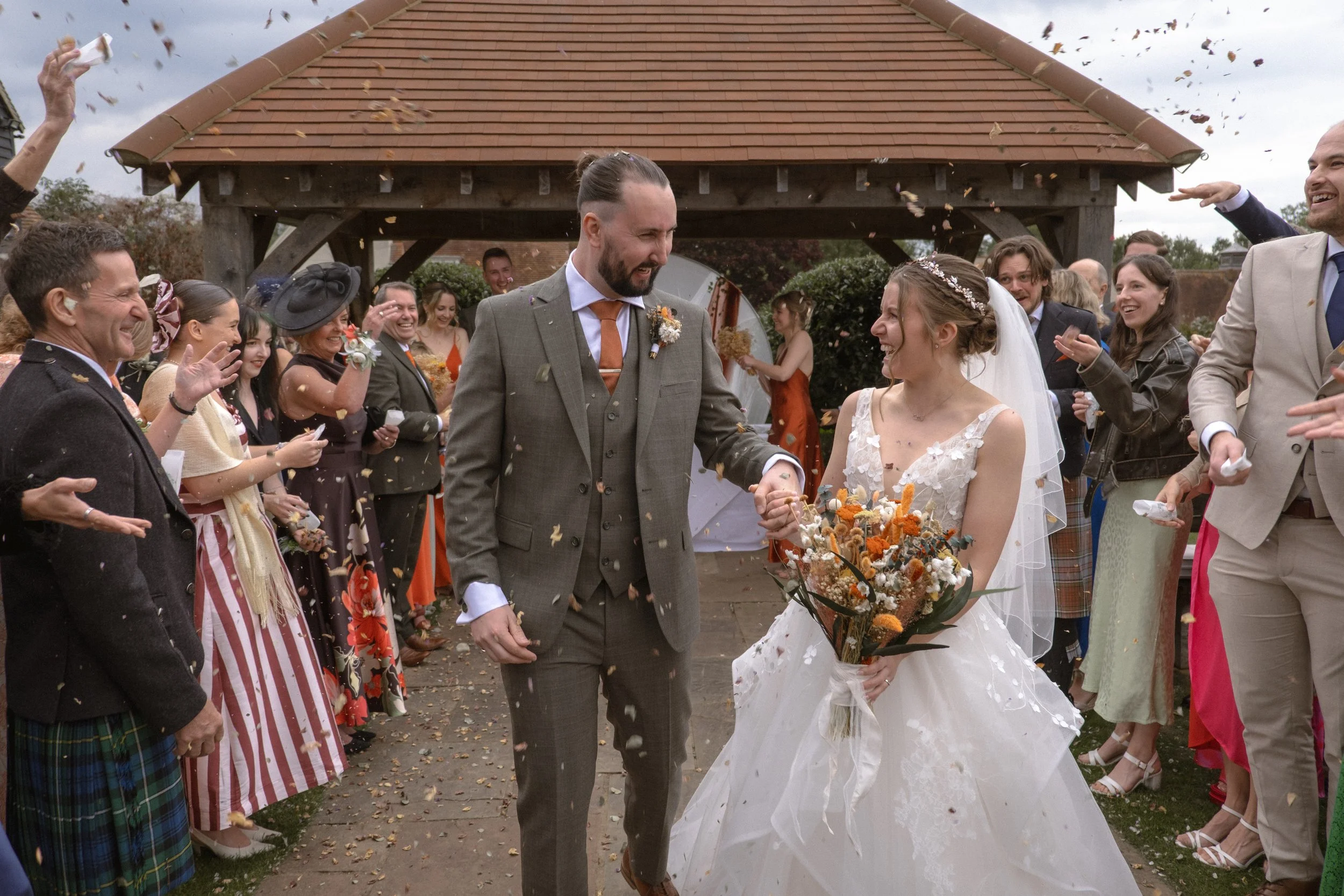 Wedding Photography confetti walk at The Warren Estate in Essex