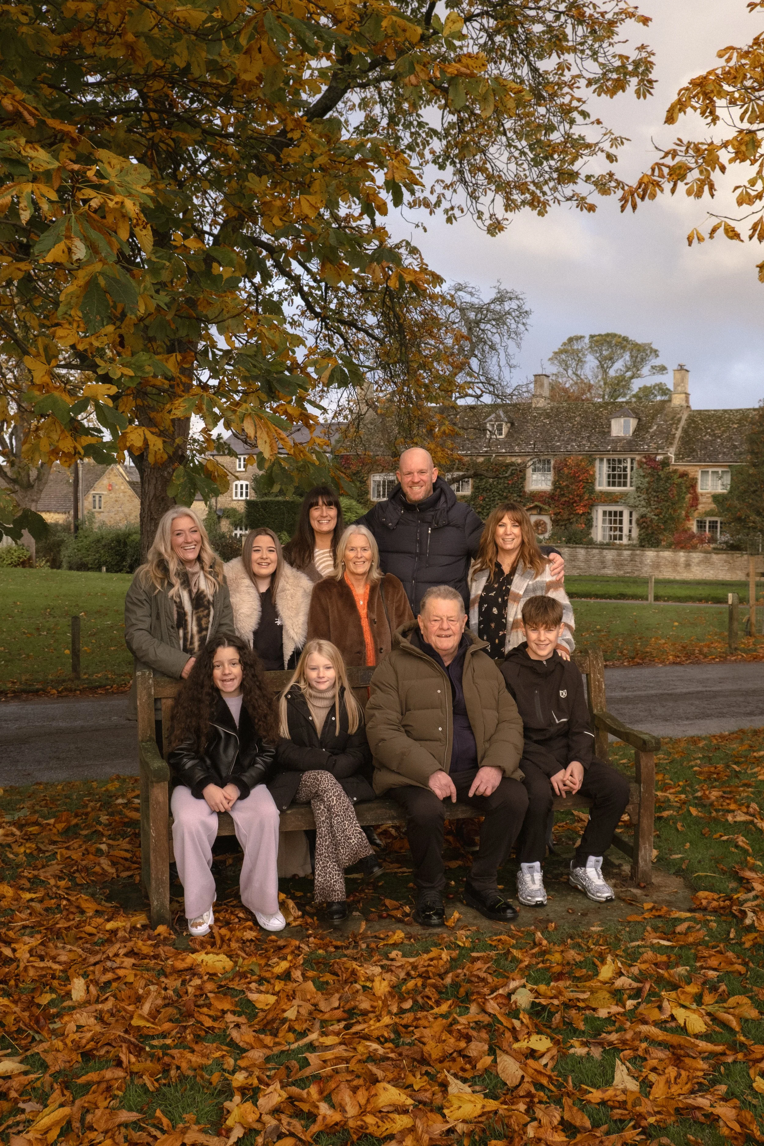 Older children and grandparents family portraits in Kingham in Oxfordshire. Cotswolds family portrait photographer. Autumn family photoshoot