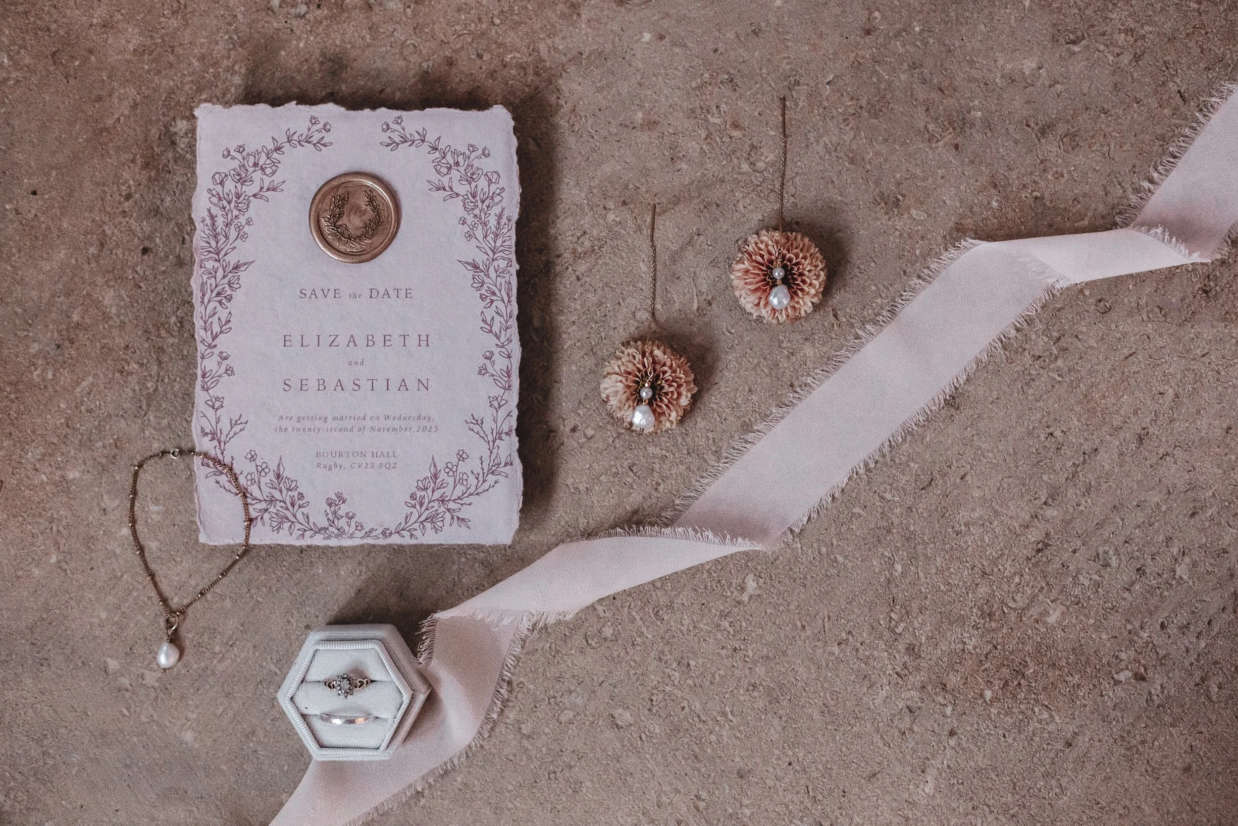 Wedding invite details flat lay at Bourton Hall, Warwickshire