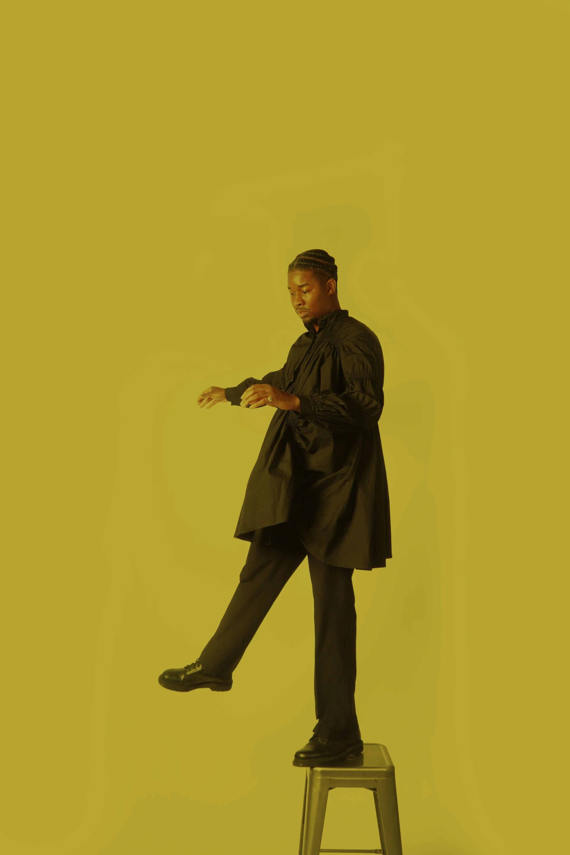 Joseph Valenté A Good Time Yellow standing on chair.JPG