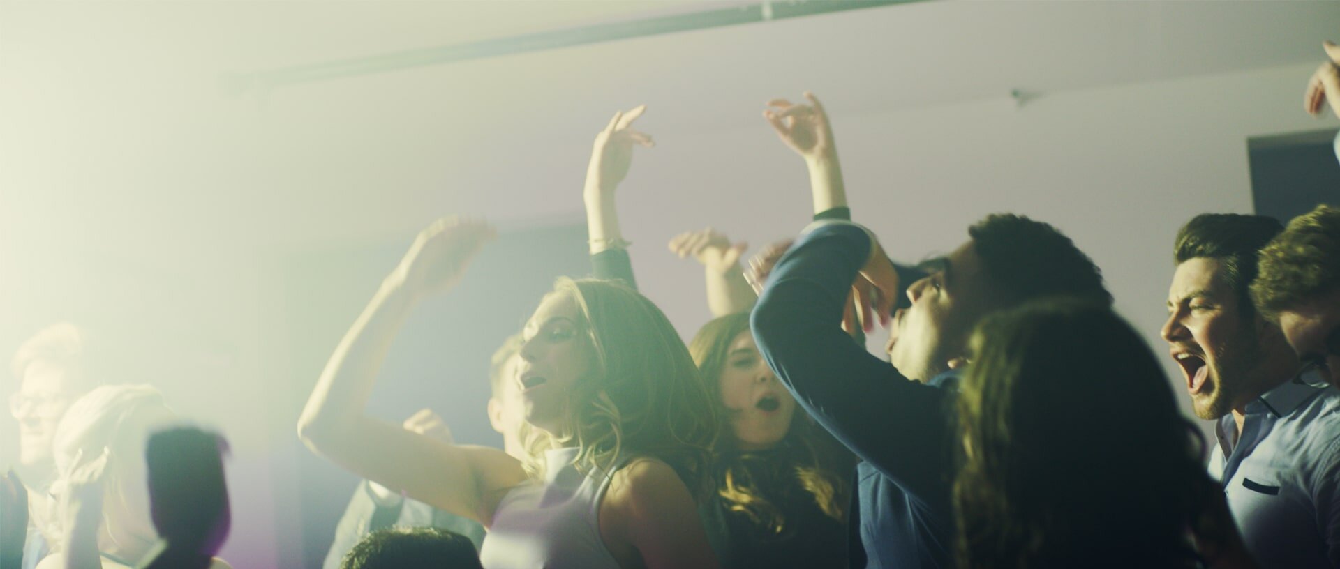Young adults celebrating company success