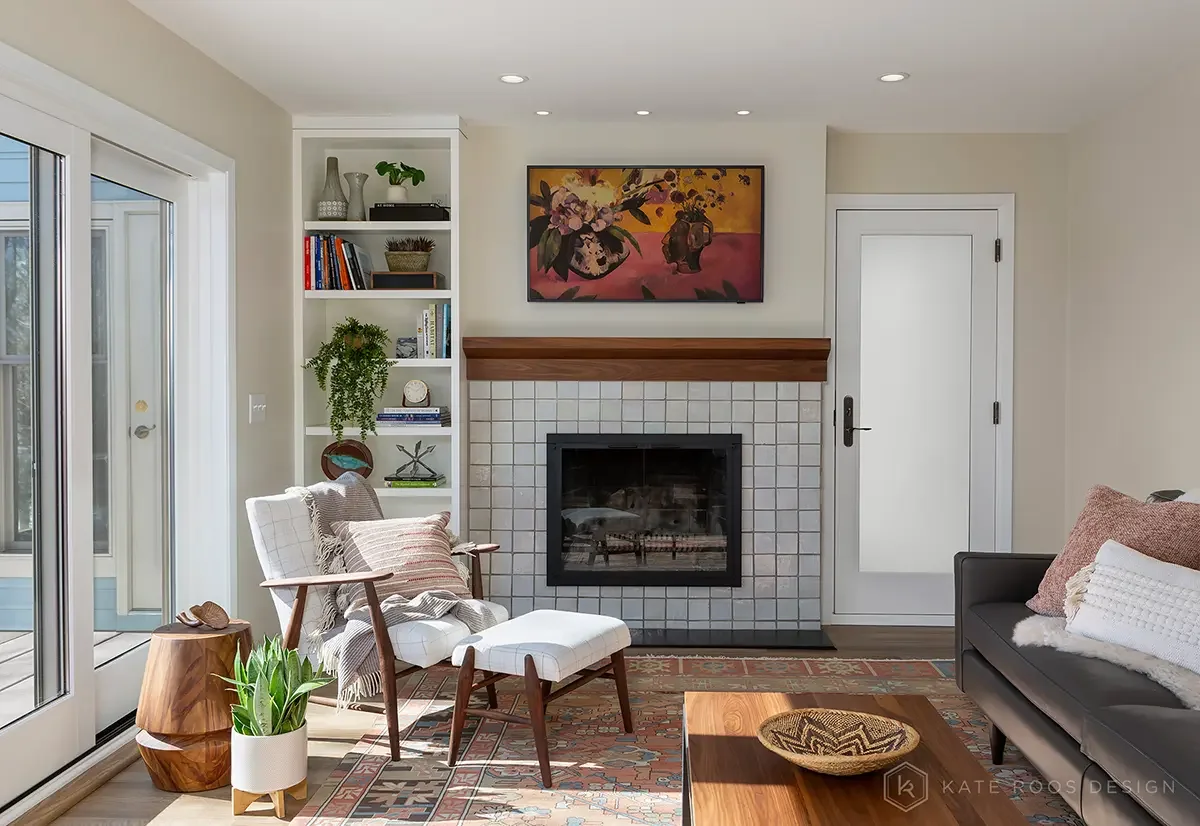 This warm and sunlit living space by Kate Roos Design, a trusted interior designer in Minneapolis, captures the essence of modern comfort with a nod to mid-century charm. Clean lines, layered textures, and curated art create a space that feels person
