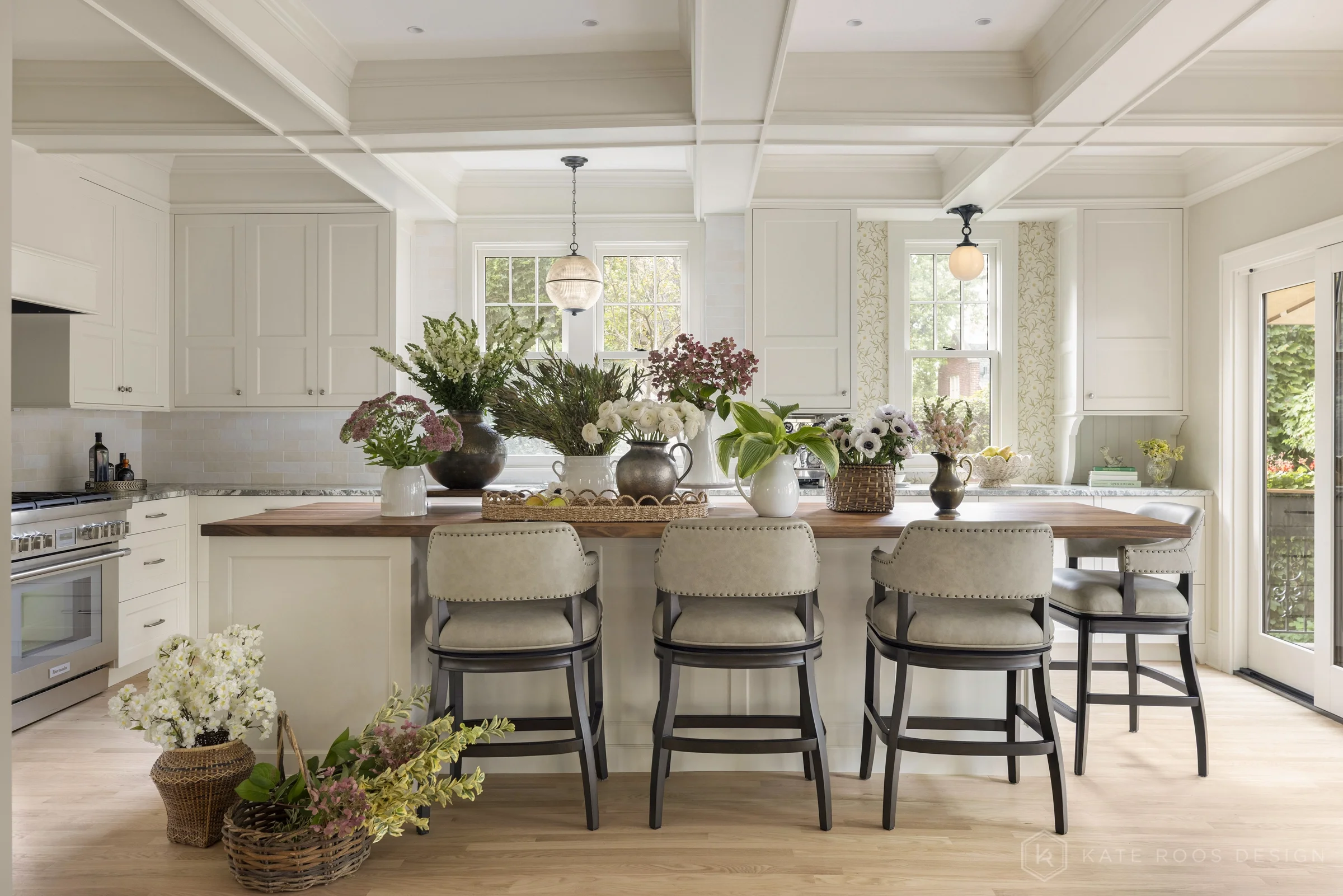 A beautiful balance of traditional architecture and modern functionality, the Christie Kitchen is a study in thoughtful details, refined materials, and timeless design.

Warm white custom cabinetry, an architectural coffered ceiling, and delicate pat