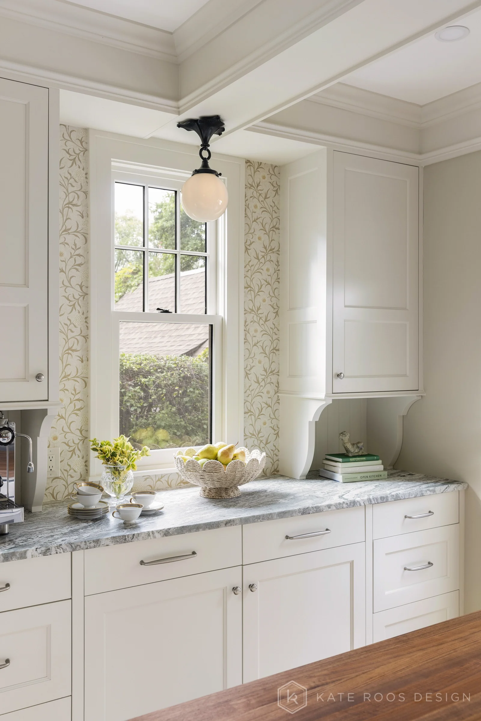 A beautiful balance of traditional architecture and modern functionality, the Christie Kitchen is a study in thoughtful details, refined materials, and timeless design.

Warm white custom cabinetry, an architectural coffered ceiling, and delicate pat