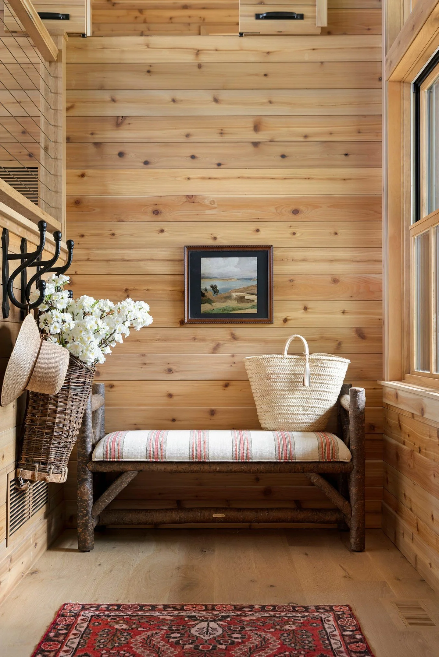 Whitefish Point and perfect landing spot. ✨⁣
⁣
A thoughtfully designed entry sets the tone for the whole home &mdash; a place to pause, drop your bag, kick off your shoes, and ease into the weekend. This cozy nook is anchored by a custom bench, handc
