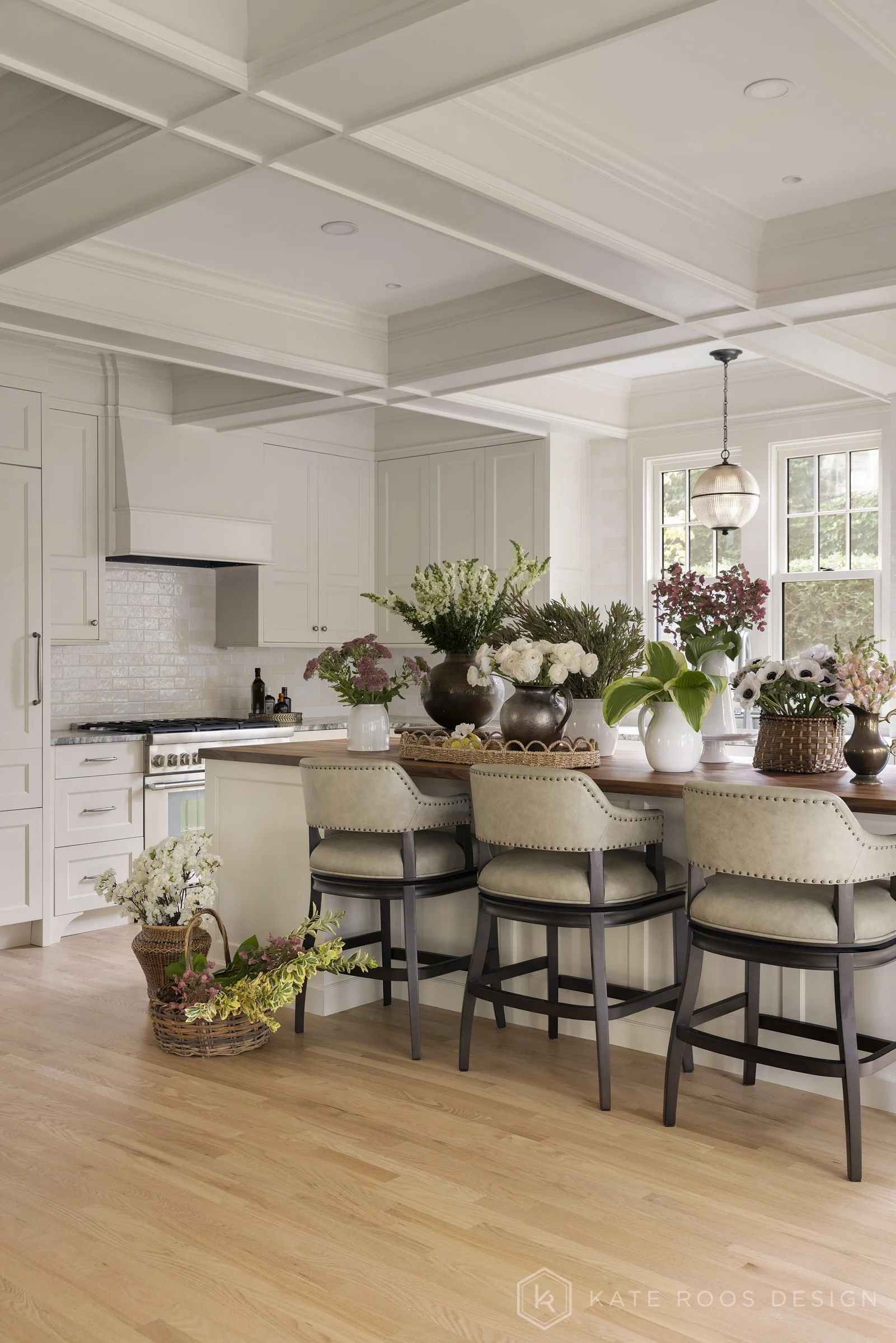 A beautiful balance of traditional architecture and modern functionality, the Christie Kitchen is a study in thoughtful details, refined materials, and timeless design.

Warm white custom cabinetry, an architectural coffered ceiling, and delicate pat
