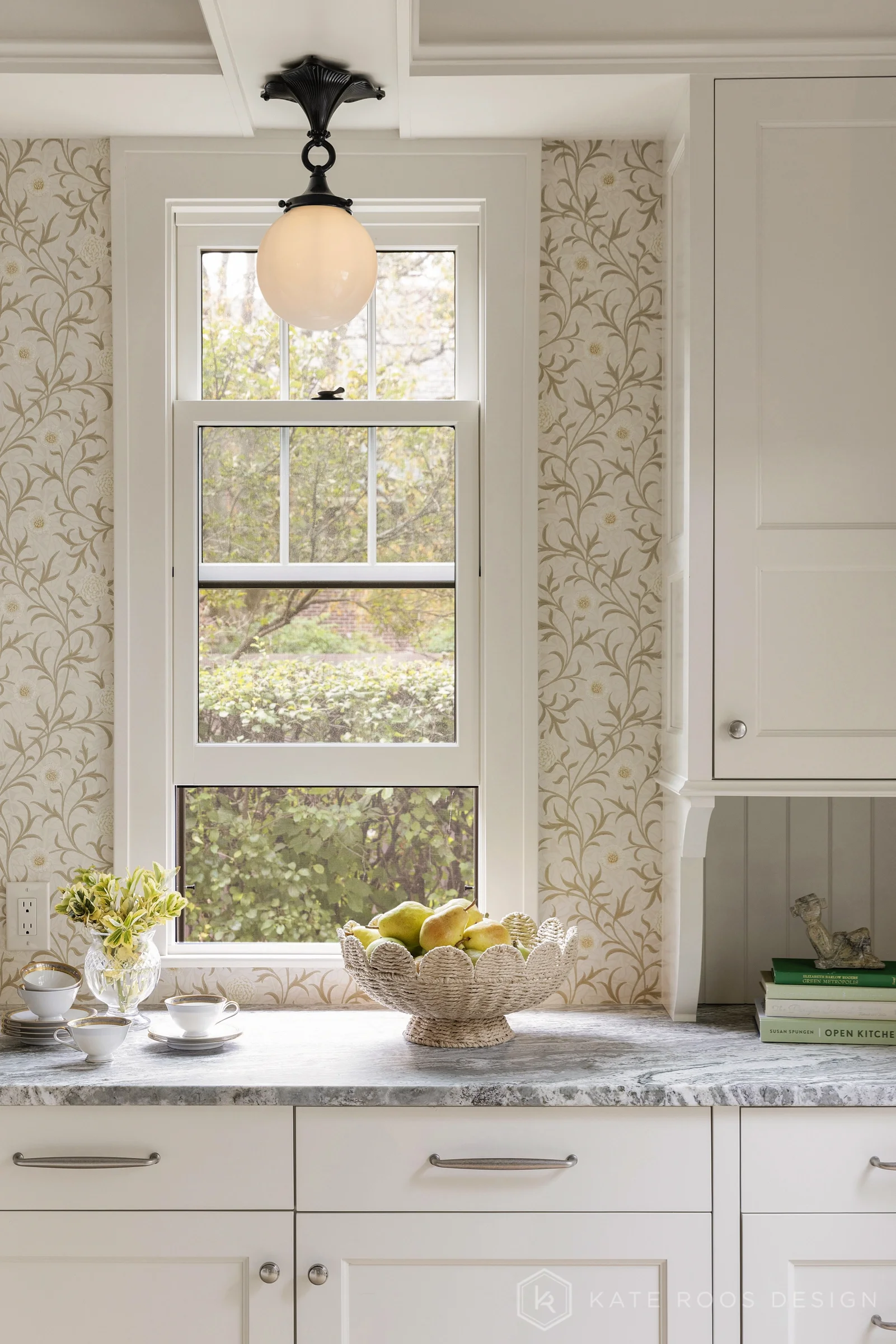 A beautiful balance of traditional architecture and modern functionality, the Christie Kitchen is a study in thoughtful details, refined materials, and timeless design.

Warm white custom cabinetry, an architectural coffered ceiling, and delicate pat