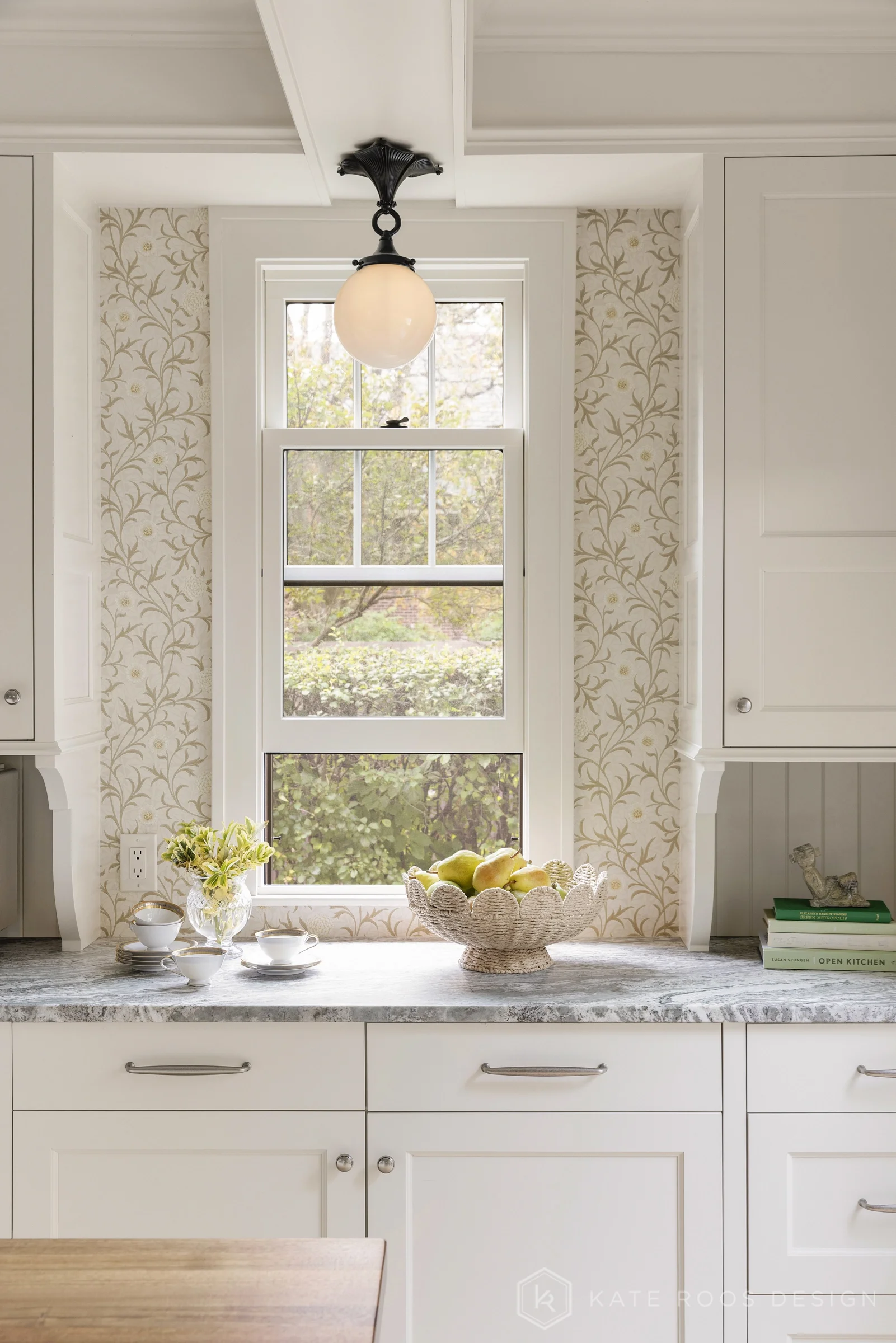 A beautiful balance of traditional architecture and modern functionality, the Christie Kitchen is a study in thoughtful details, refined materials, and timeless design.

Warm white custom cabinetry, an architectural coffered ceiling, and delicate pat
