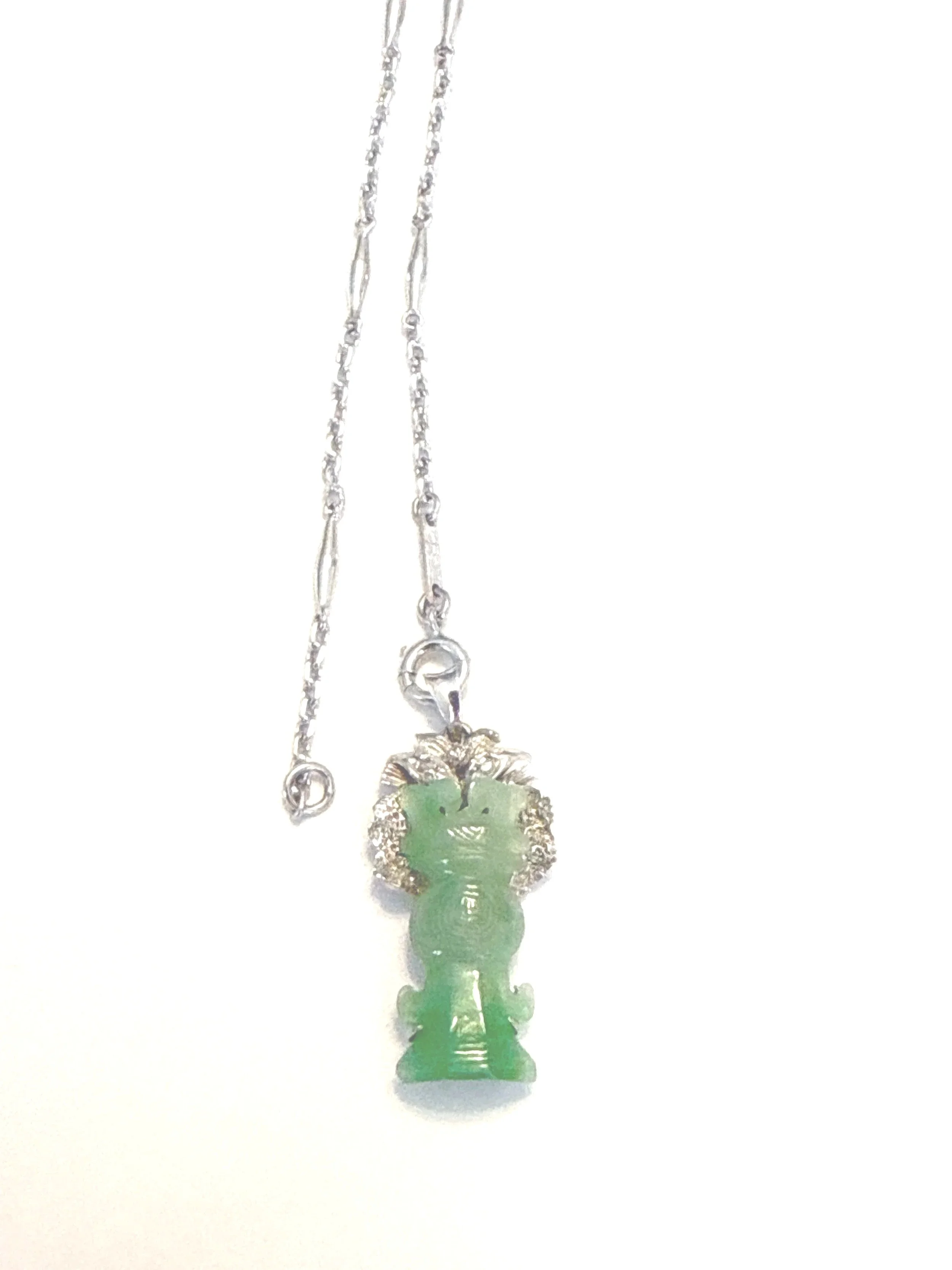 257.  Lady's rhodium plated platinum station link chain, 19" long, 12.41 grams  with 925 Sterling, Jadeite and diamond pendant. Appraisal Certificate included Value $2630.