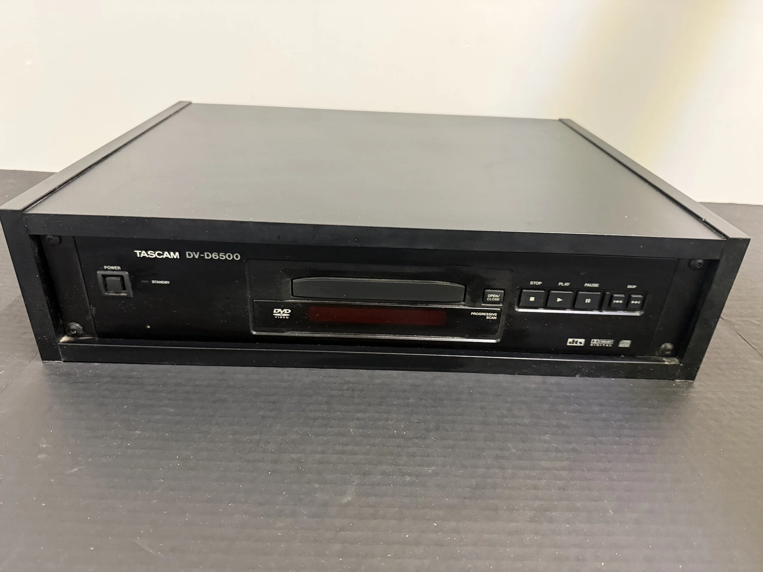 159.  Tascam DV-6500 Professional Controllable DVD player in wooden case, not tested, as is smoking environment