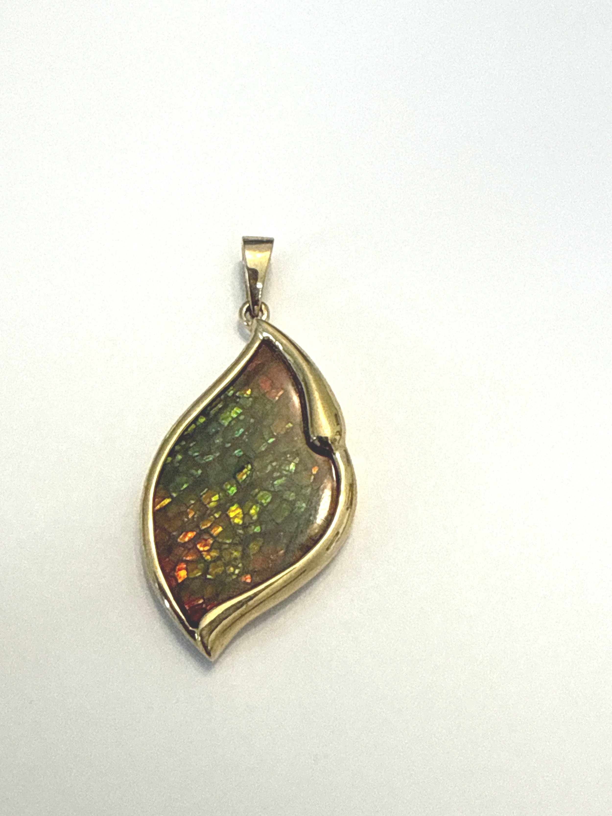 258.  Lady's custom, polished 18K yellow gold, ammolite pendant, 8.31 grams, stamped 18K,  very good condition.  Appraisal Certificate included Value $3150 .