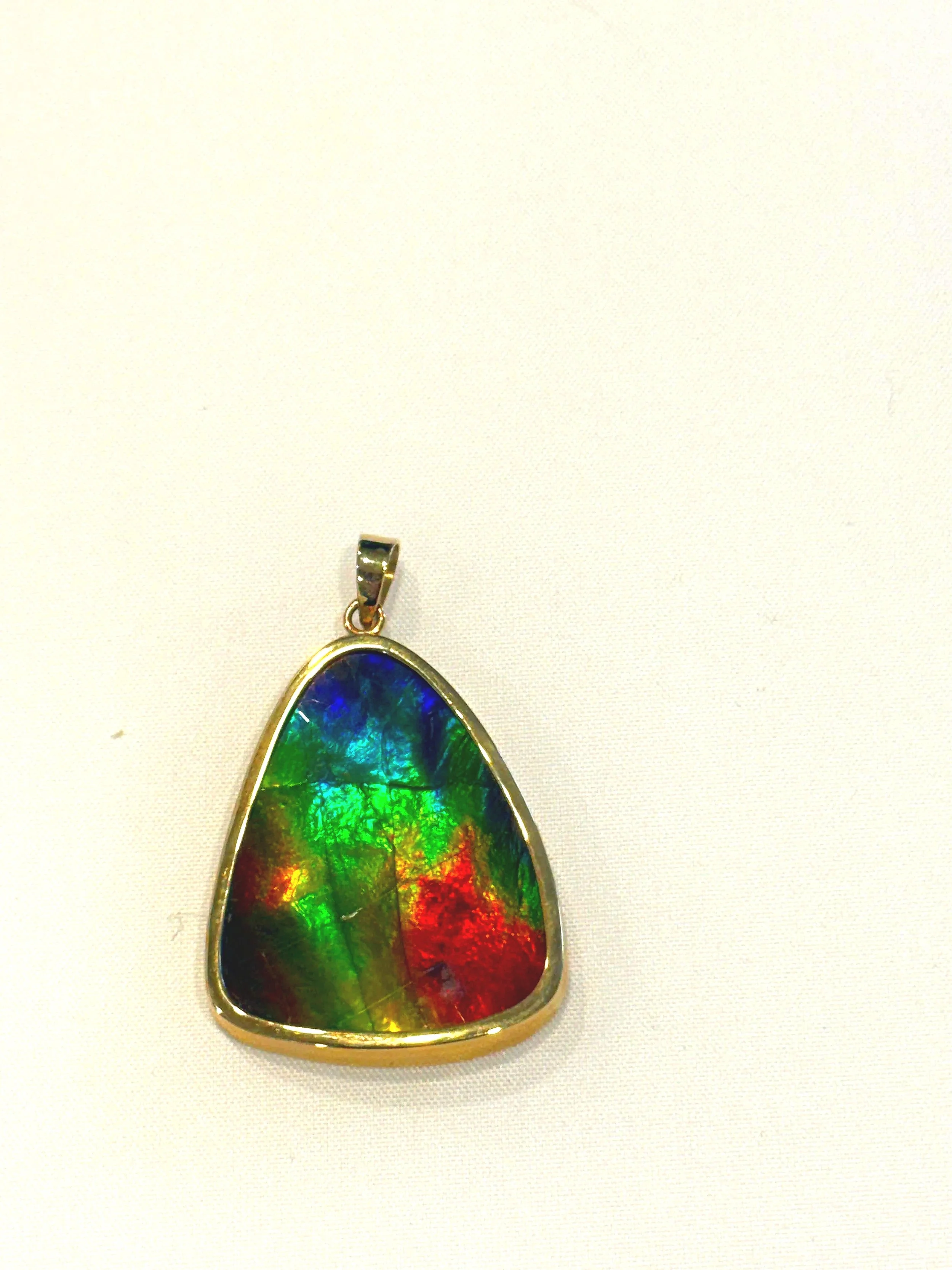 260.  Lady's custom,  polished 18K yellow gold, ammolite pendant, 9.34 grams, stamped 18K, very good condition.   Appraisal Certificate included Valued $4130.