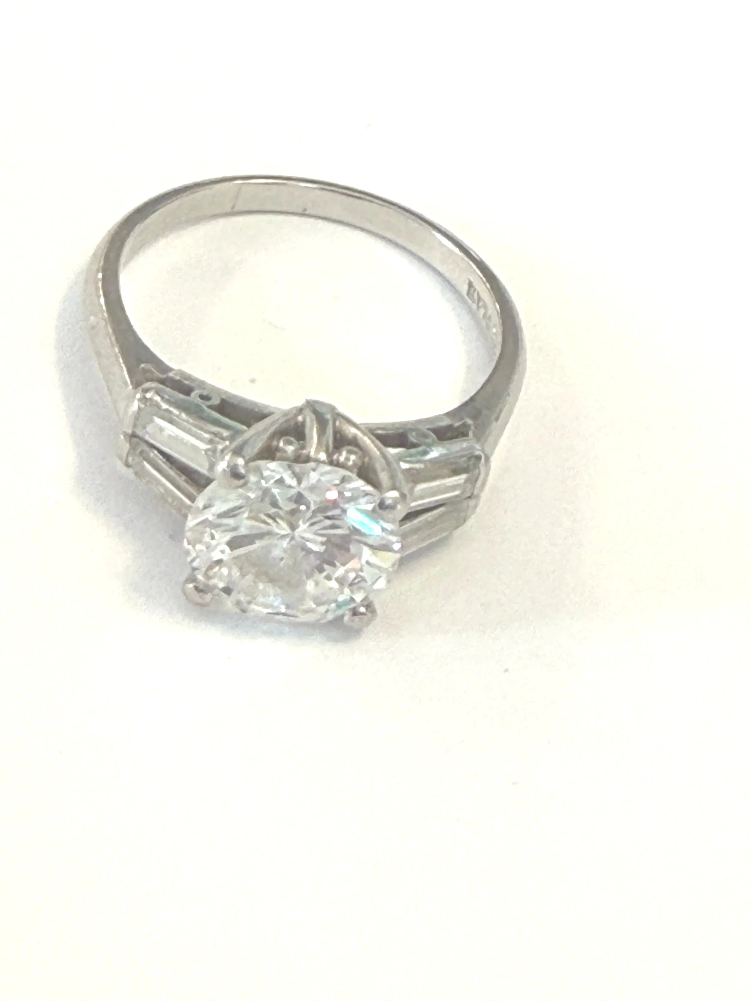 263.  Lady's polished platinum, diamond engagement ring, 4.59 grams, stamped PLAT in good condition Size 5.5.  Appraisal Certificate included Value $27,900.