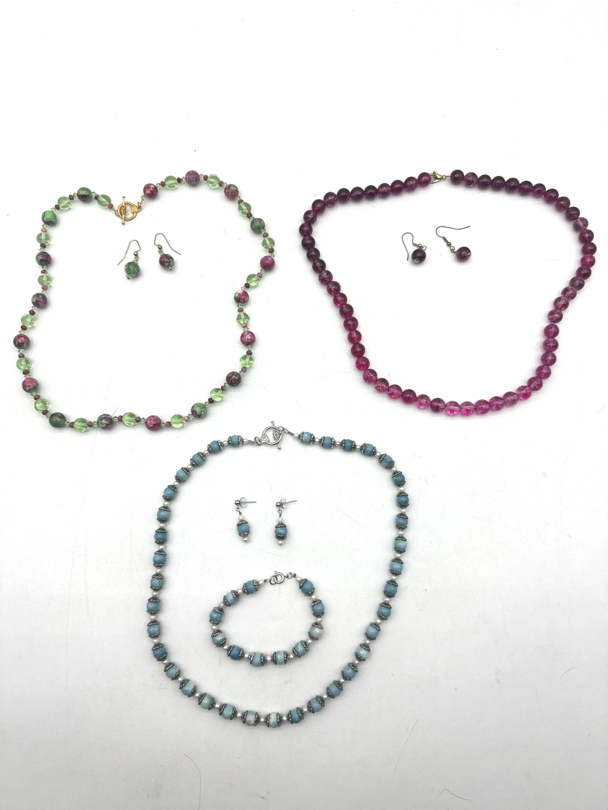 682.  3 genuine stones necklaces with matching earrings and a bracelet 20''-22''