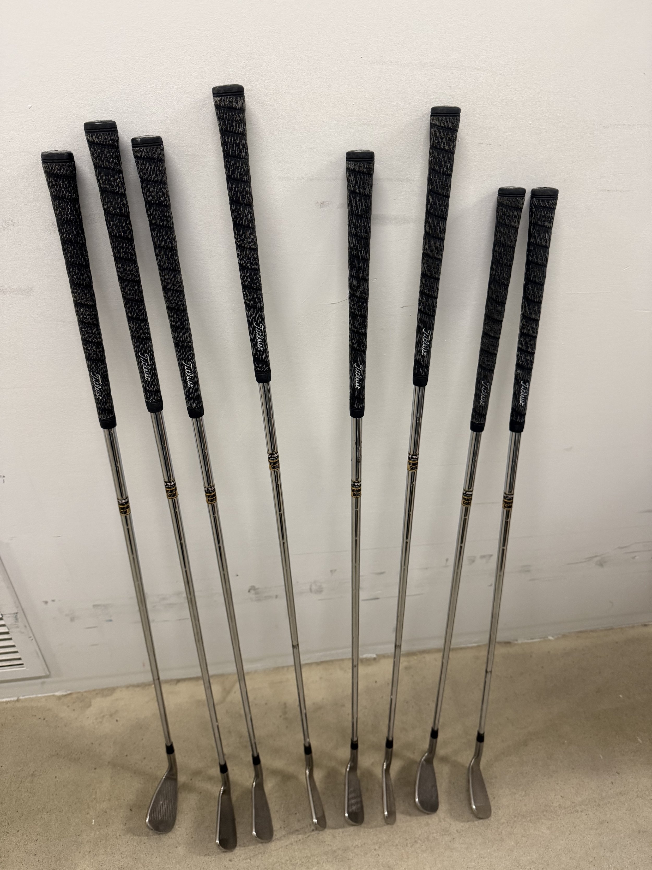 137.  Titleist Dymanite Gold 3, 4, 5, 6, 7, 8, 9 irons with pitching wedge, new in box