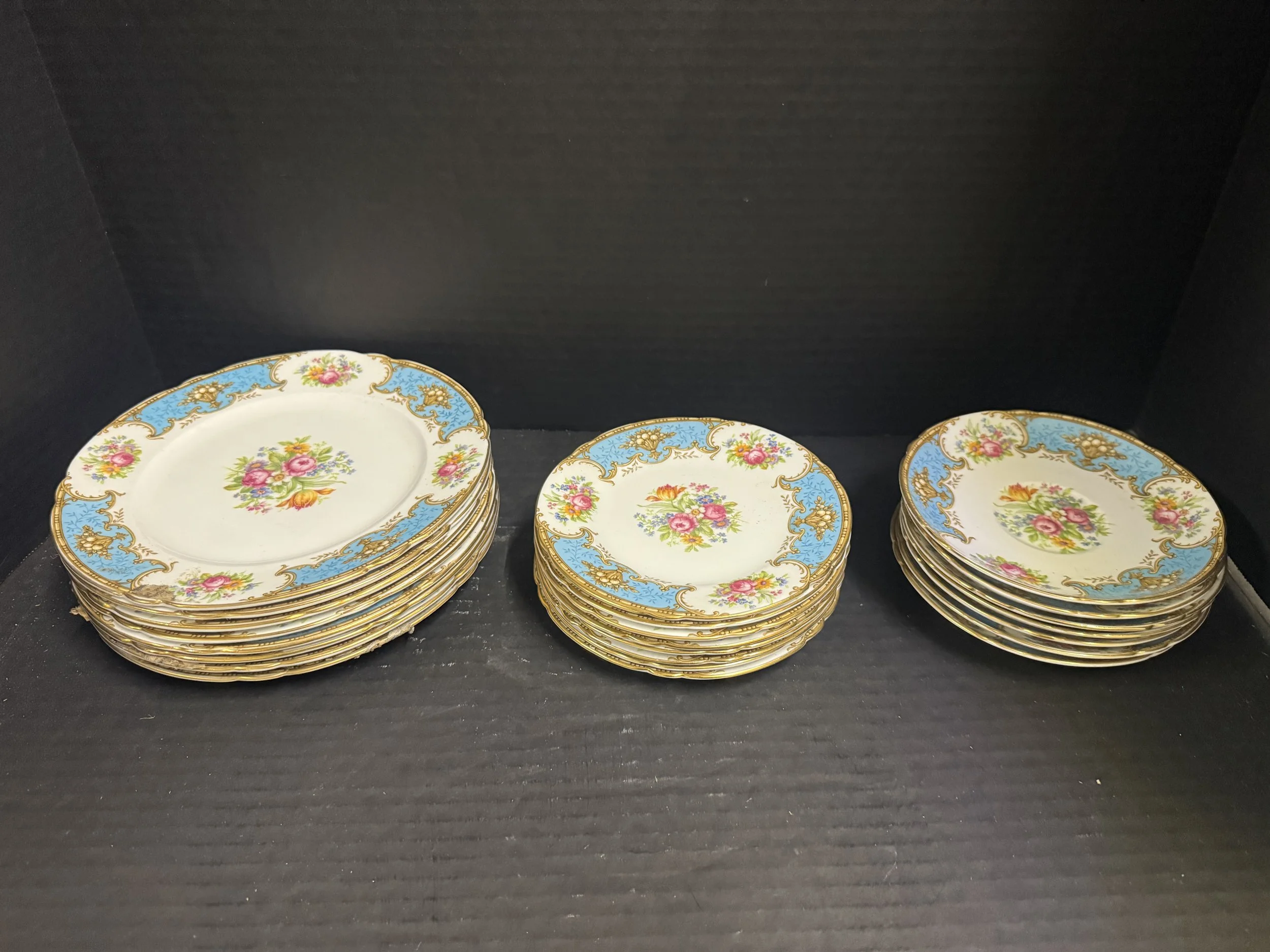 118.  Shelley China "Duchess" pattern partial dinnerware includes 7 saucers, 8 bread & butter plates, 8 dessert plates