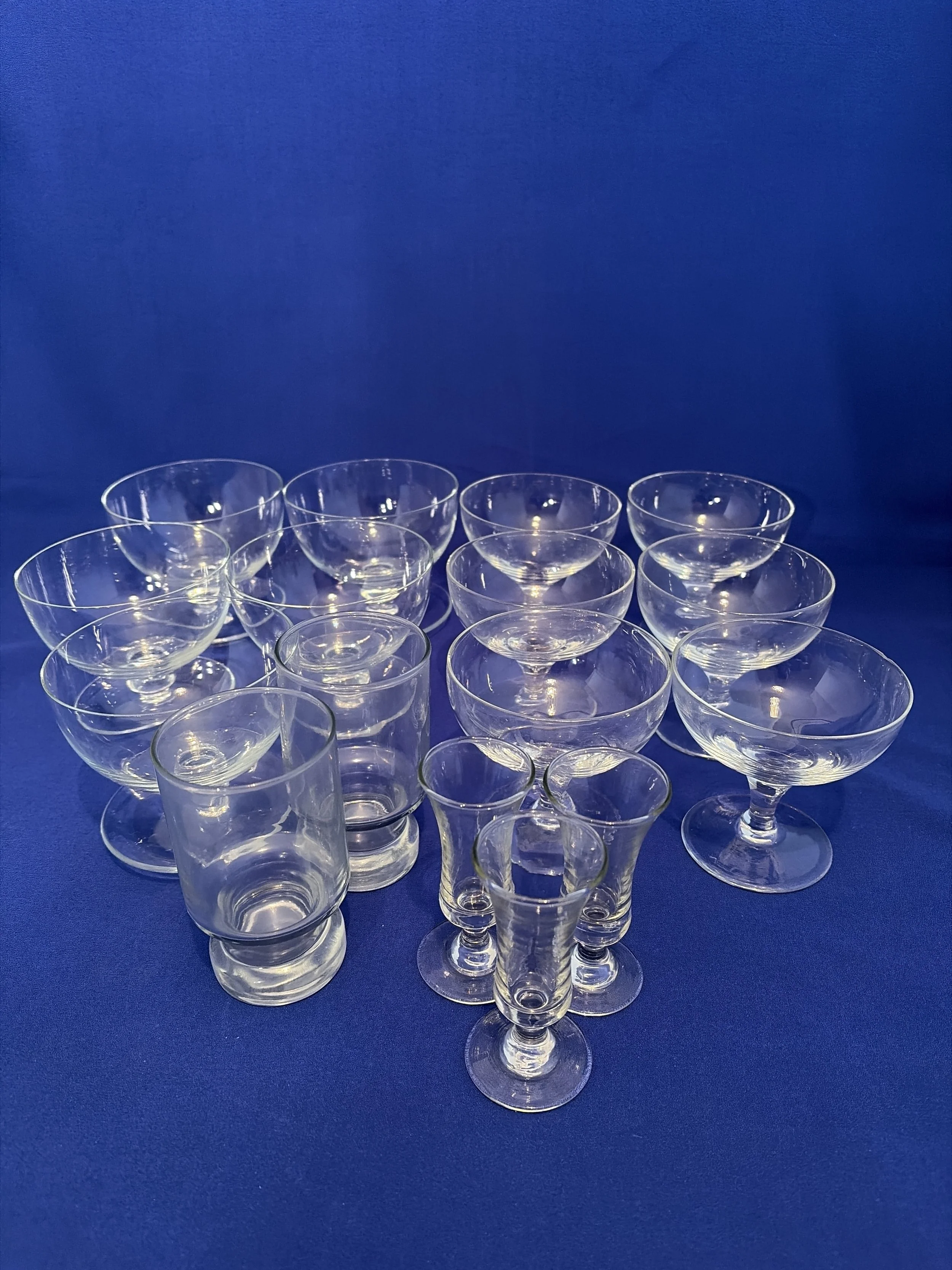 101.  Selection of 9 footed stems, three shot glasses and two juice glasses, tallest 4"