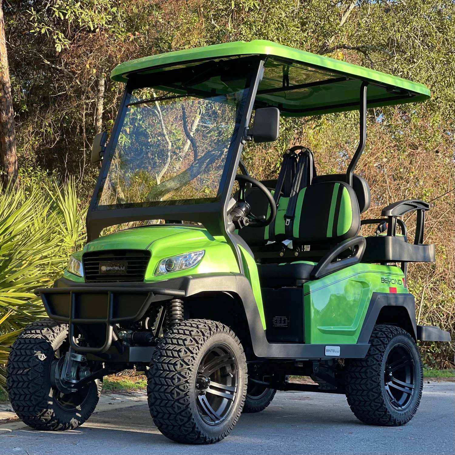 L4LB41L lime green lifted 4 seat electric street legal golf cart LSV on the Emerald Coast