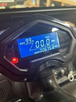 Close up of the SOC display reading 99 percent charged