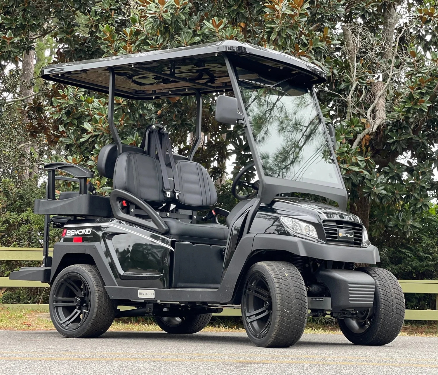 4BB31 black 4 seat electric street legal golf cart LSV on the Emerald Coast