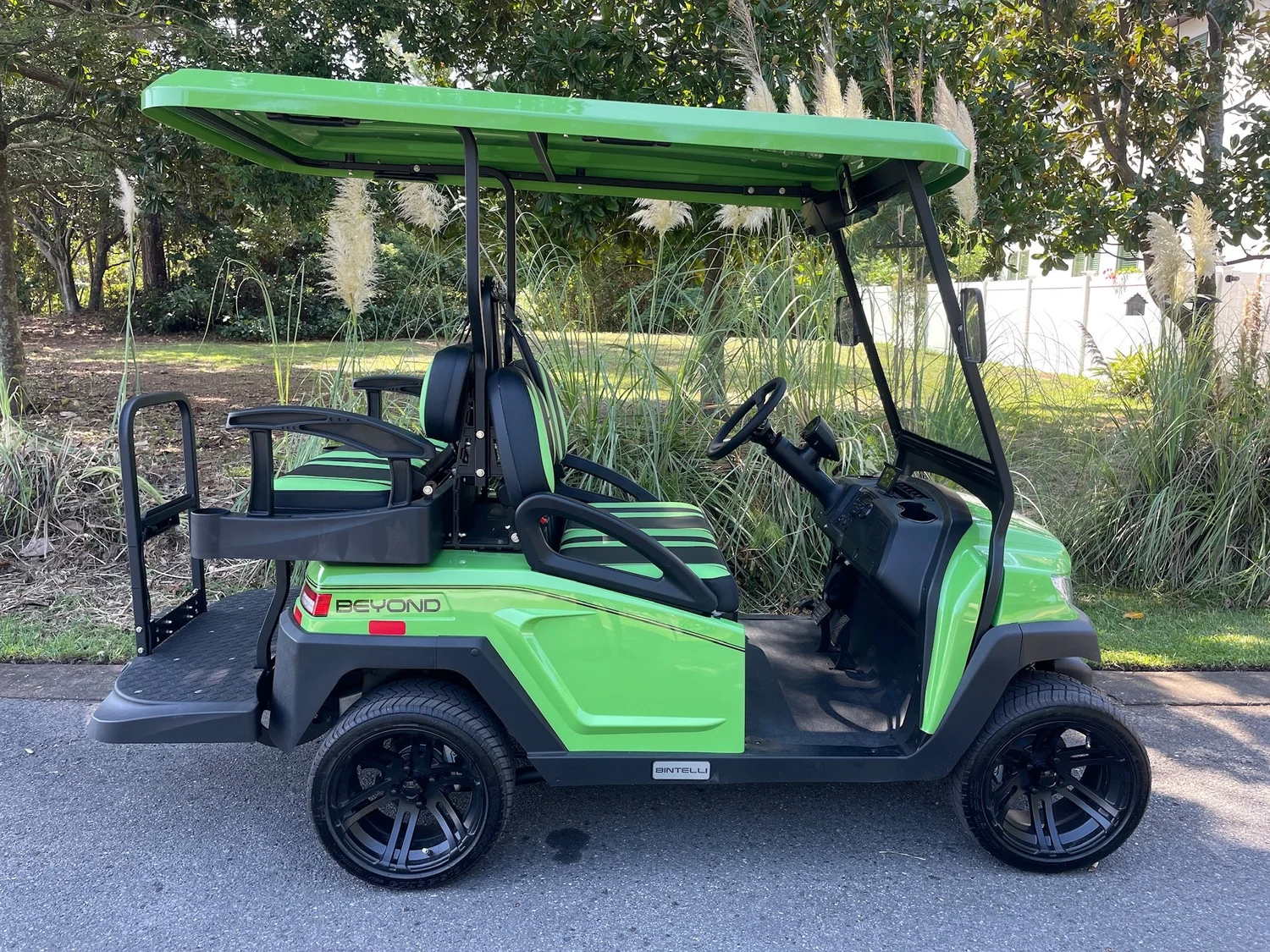 4LB12L lime green 4 seat electric street legal golf cart LSV on the Emerald Coast