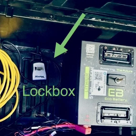 Lockbox under the middle row seat of a lithium electric cart