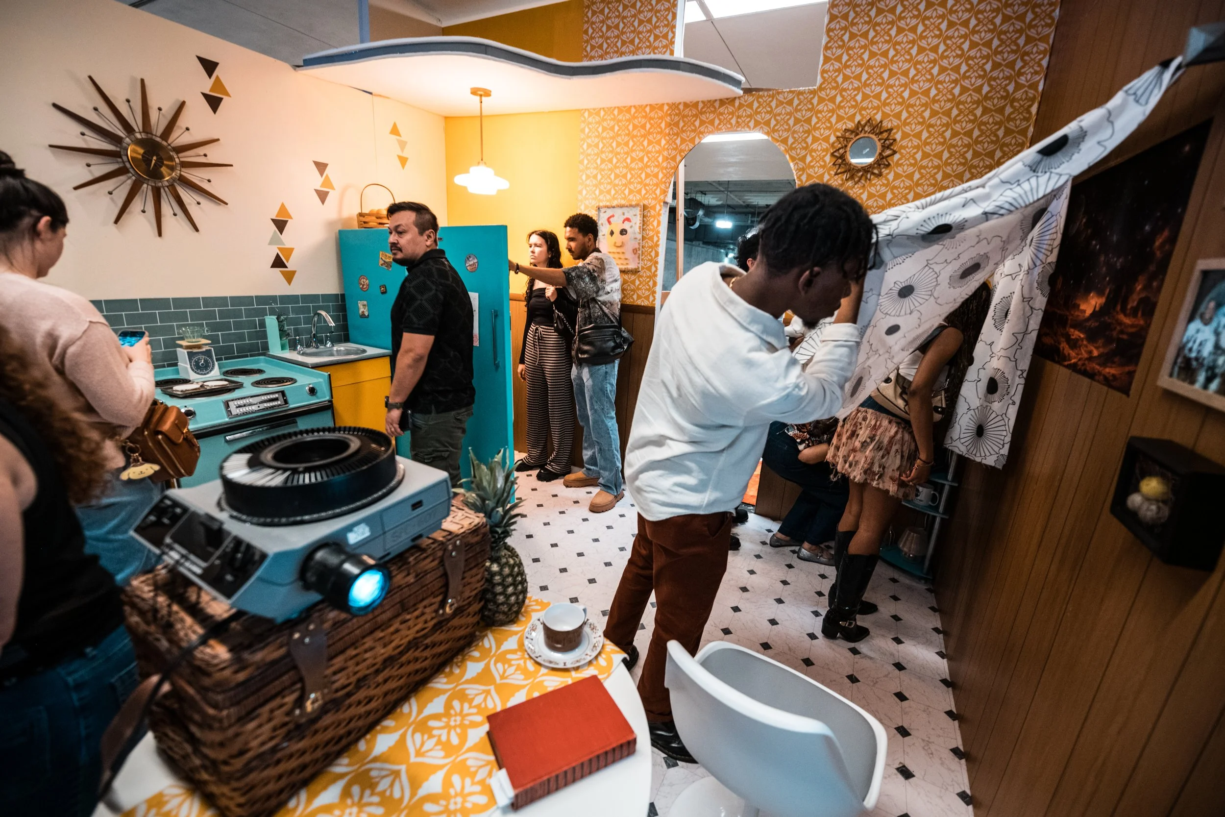 Guests interact with the kitchen designed and built by Saucer Supper Club at IMMERSE