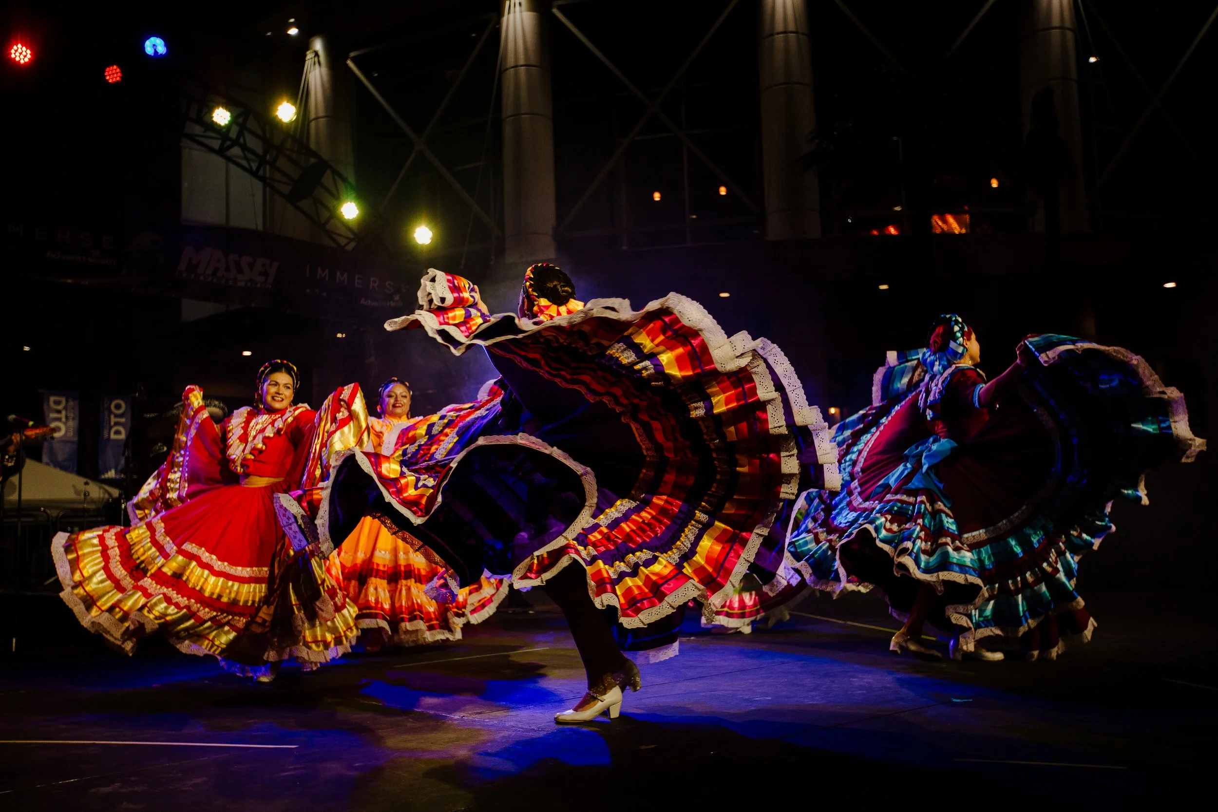 Mexico Lindo dancers display their vibrant dresses during a performance at IMMERSE