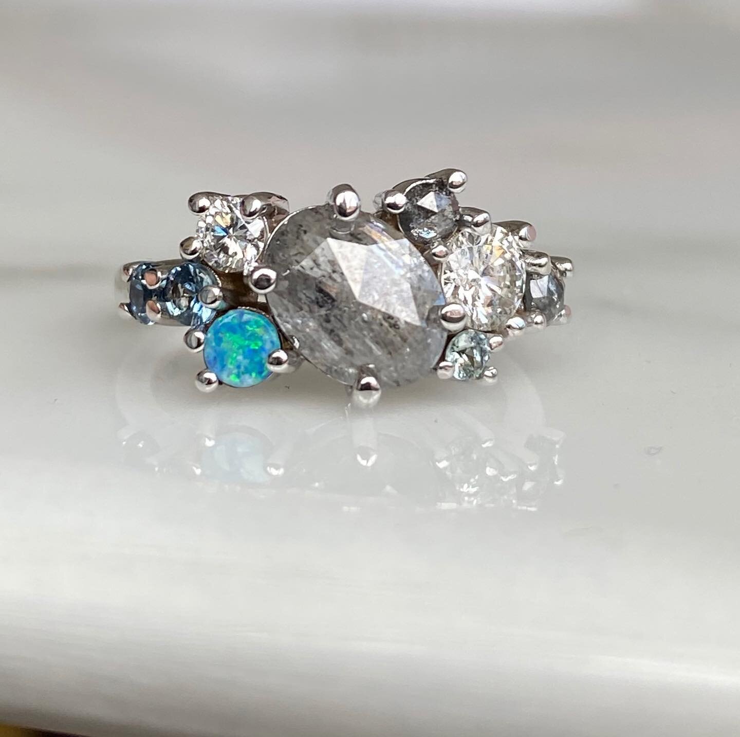 It's grey, gloomy, + rainy this morning - so I choose to stare at something way more beautiful, sparkling, grey + frosty 💎✨
⠀⠀⠀⠀⠀⠀⠀⠀⠀
Another custom ring delivered! holding birthstones of her babies, a special oval center diamond, her original engag