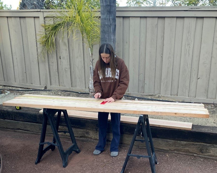 Measuring the planks before cutting