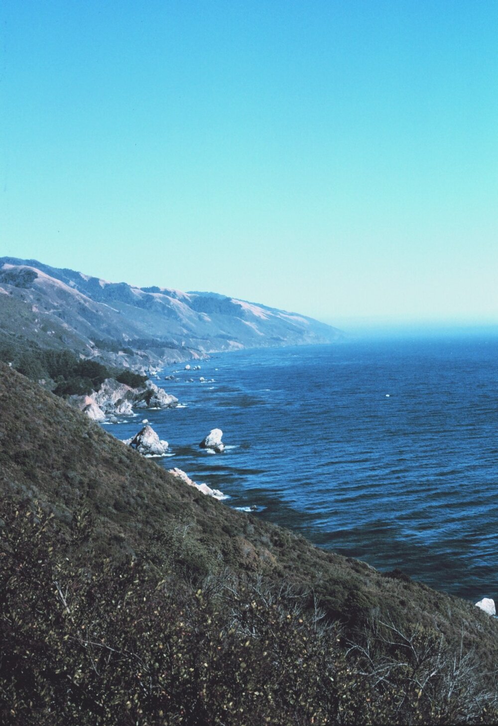 "The Big Sur coastline as seen while traveling along Highway 1" (1989) By Ben Mieremet (Affiliation: NOAA)