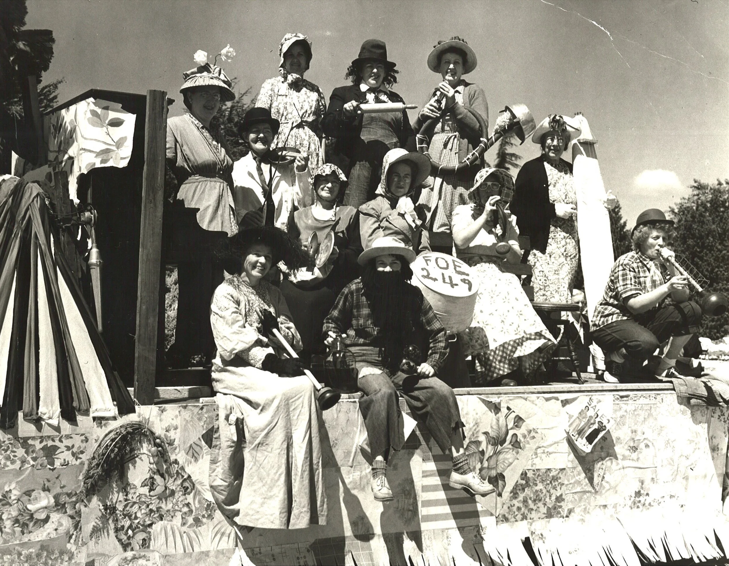  The Eagles Auxiliary Kitchen Band rode on a float in the Marineers' Pageant, c. 1949. They had homemade "instruments" from articles in a home (plunger, rolling pin, pot, ironing board, etc.).  Front row:   Ann Kidder, Doris Tursi   Second row:   Rut