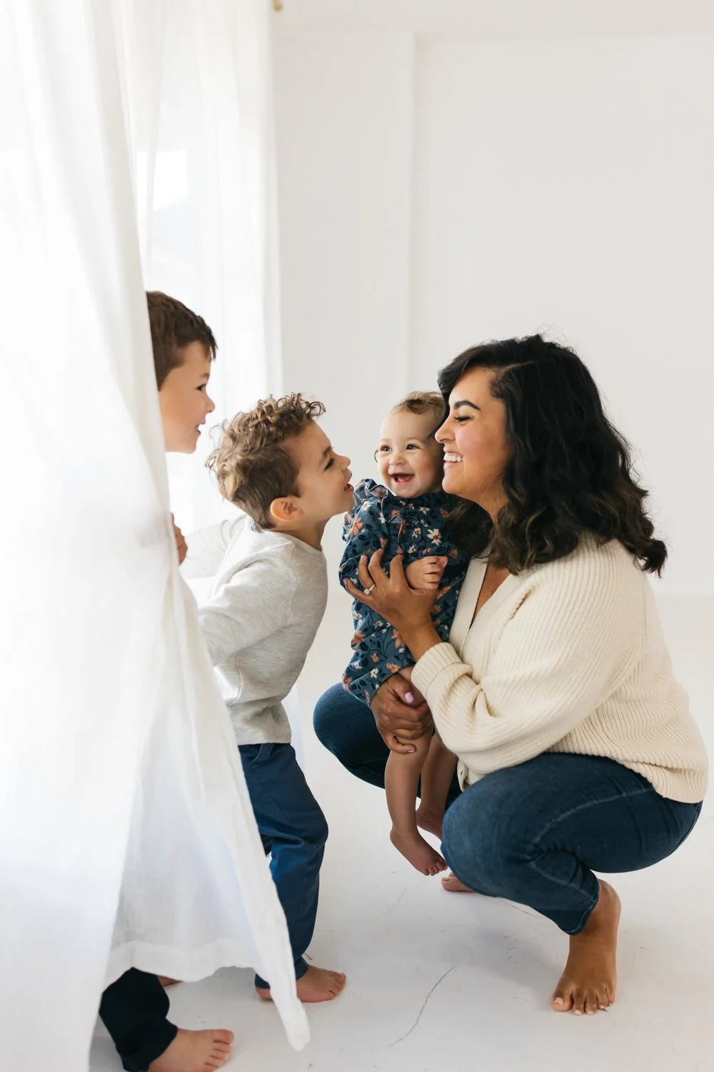 family in blue and cream colors in lifestyle studio by marin family photographer cristin more 2024_19.jpg