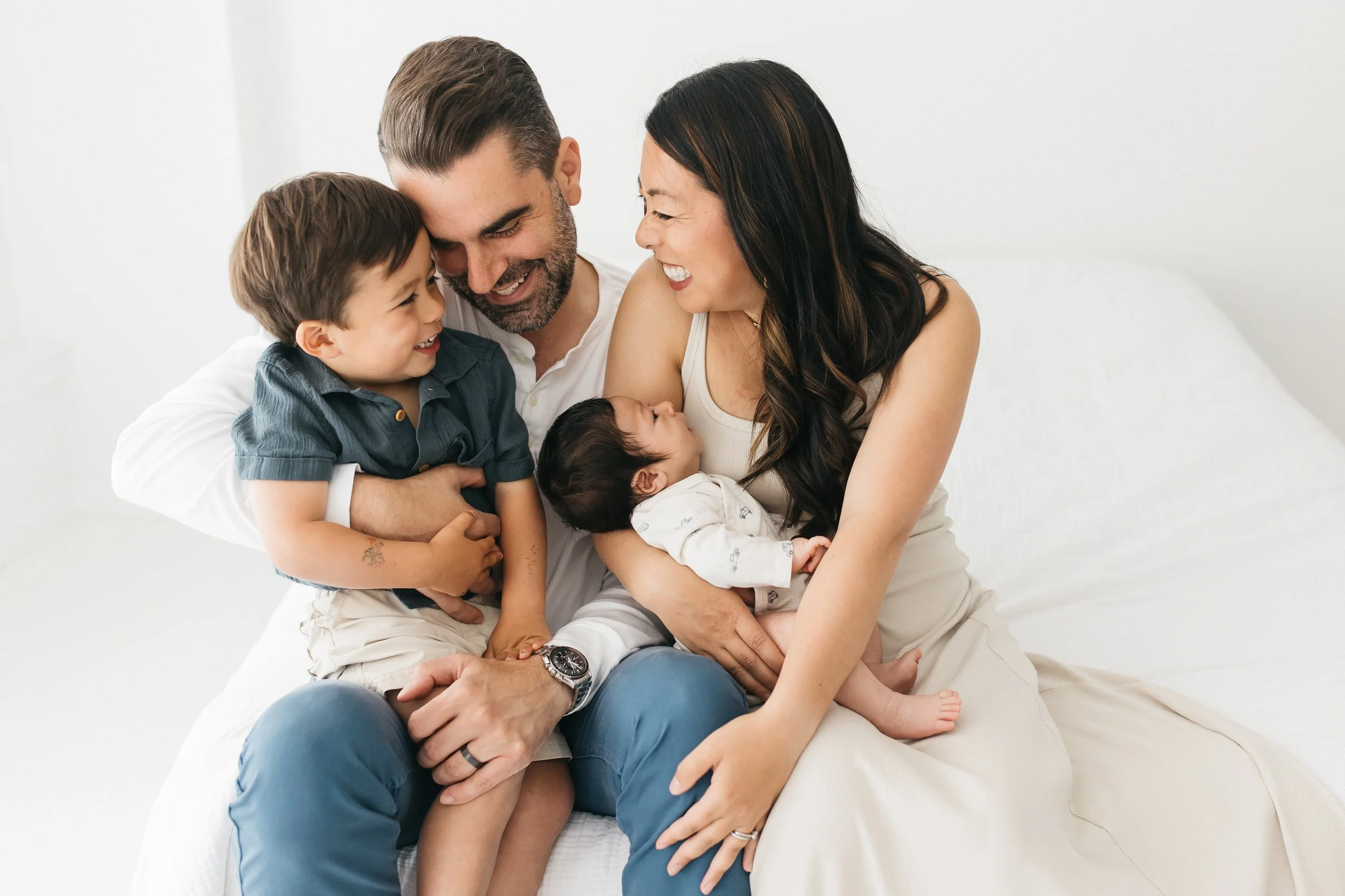 Family with newborn baby and older son sibling in Sausalito studio Marin