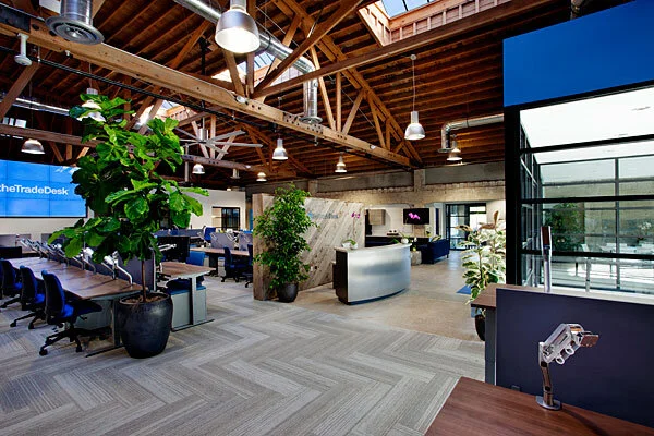 Open office at The Trade Desk in Ventura, CA, with herringbone flooring installed by Howard's Rug Company of Ventura