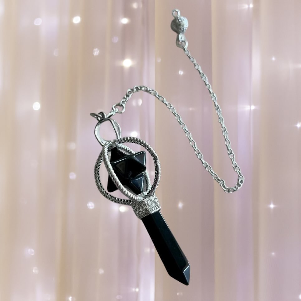 Tap into the ancient energies of protection and grounding with our Obsidian Merkabah Pendulum featuring an Obsidian point. Let this sacred tool guide you on your spiritual journey, providing clarity and insight while shielding you from negativity. #O