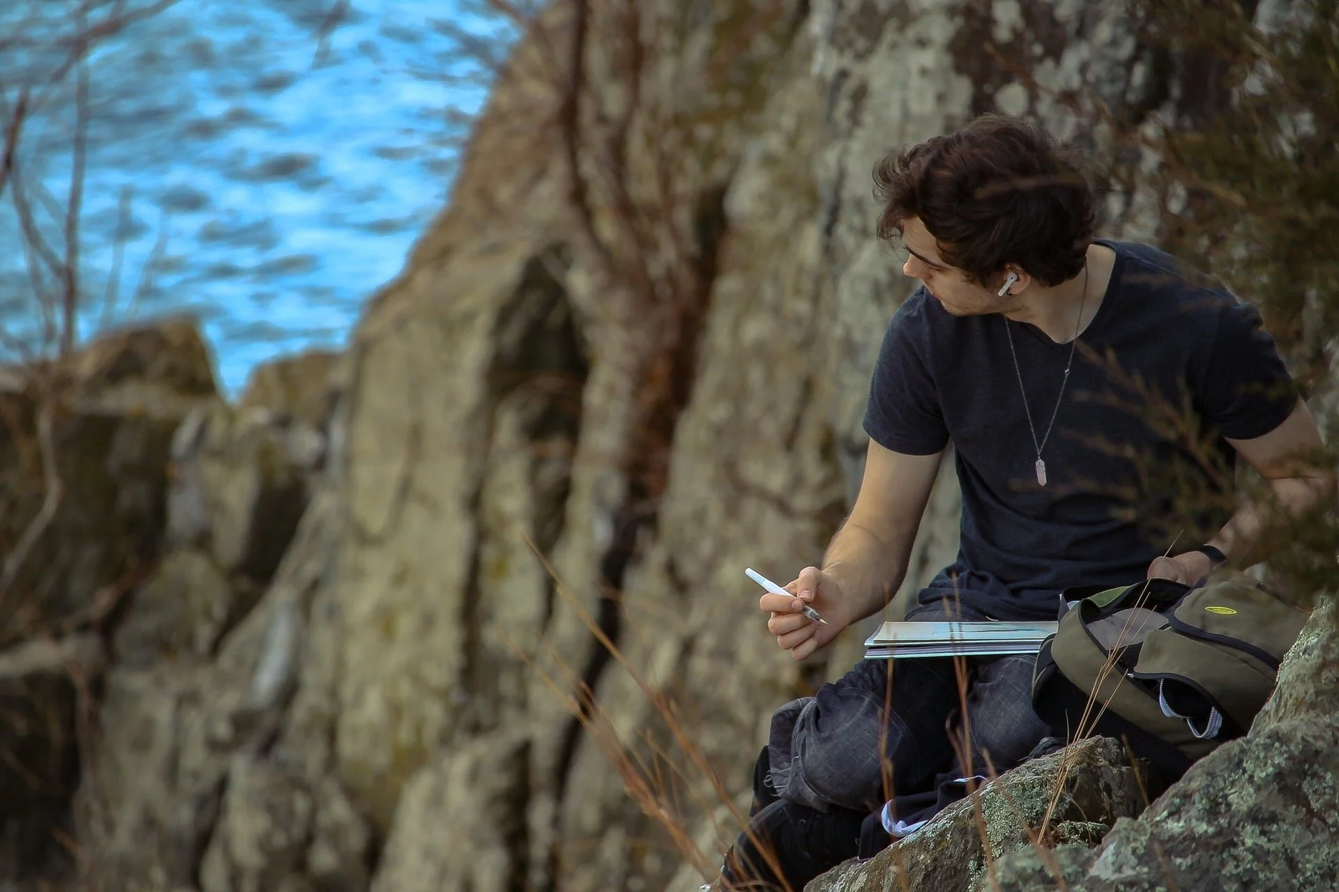 Man thinking and writing from a mountain-min.jpg