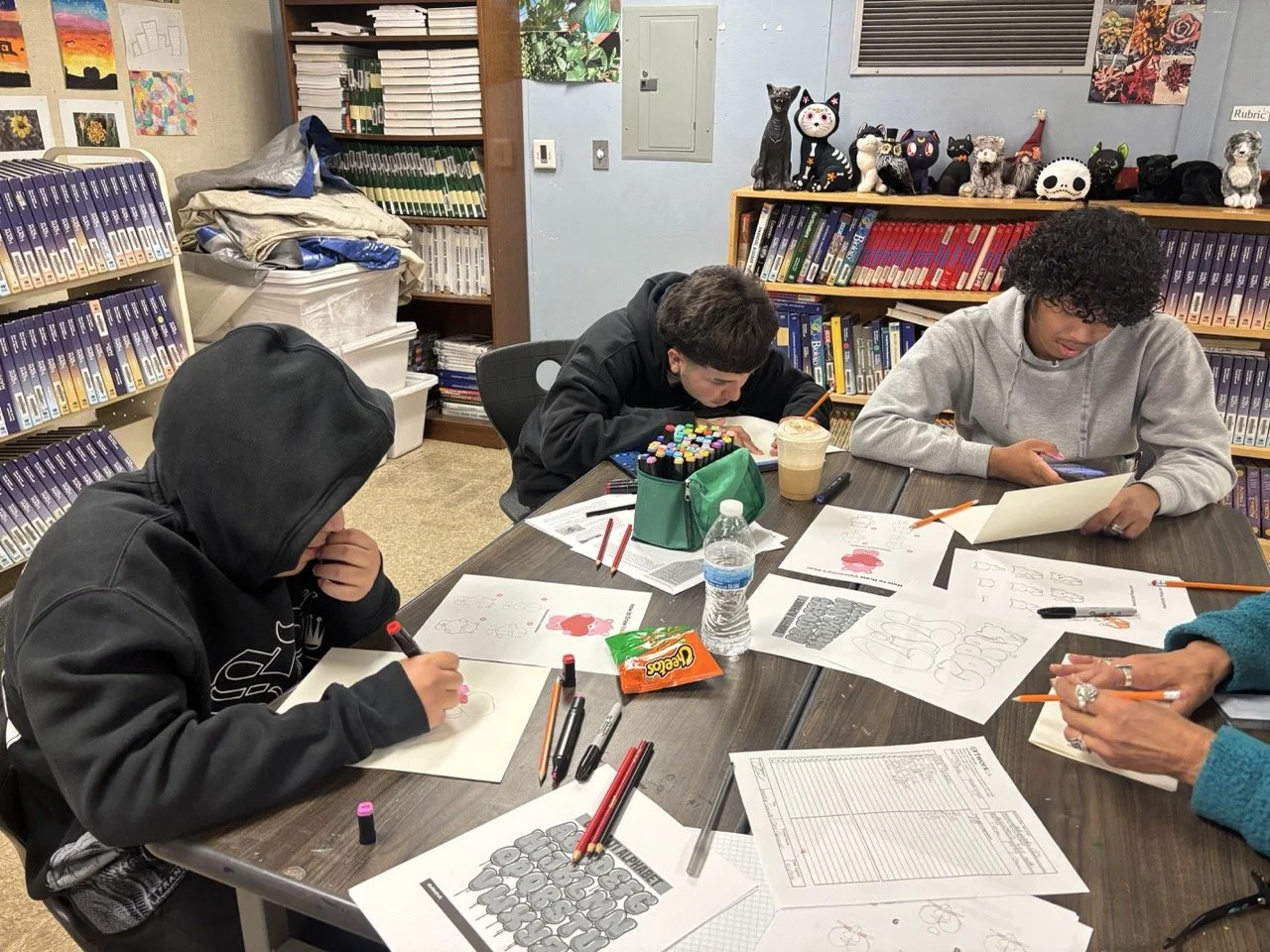 Jack London students draw cards for their loved ones with Workshop Coordinator Grace Ciacciarelli. 