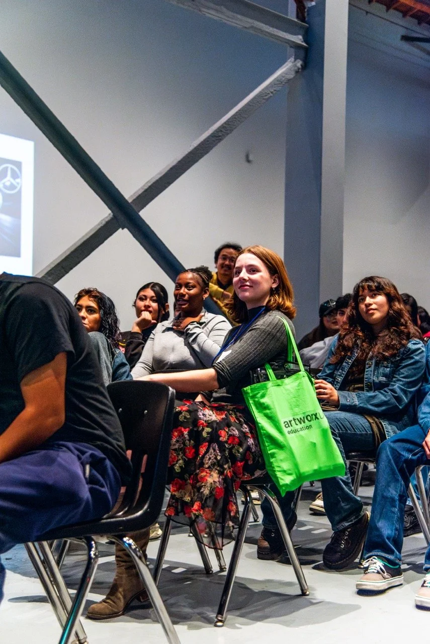 Workshop Coordinator Grace Ciacciarelli joins Jack London students to hear a presentation on the MONUMENTS exhibition.  (Photo credit: Fabiola Lopez)